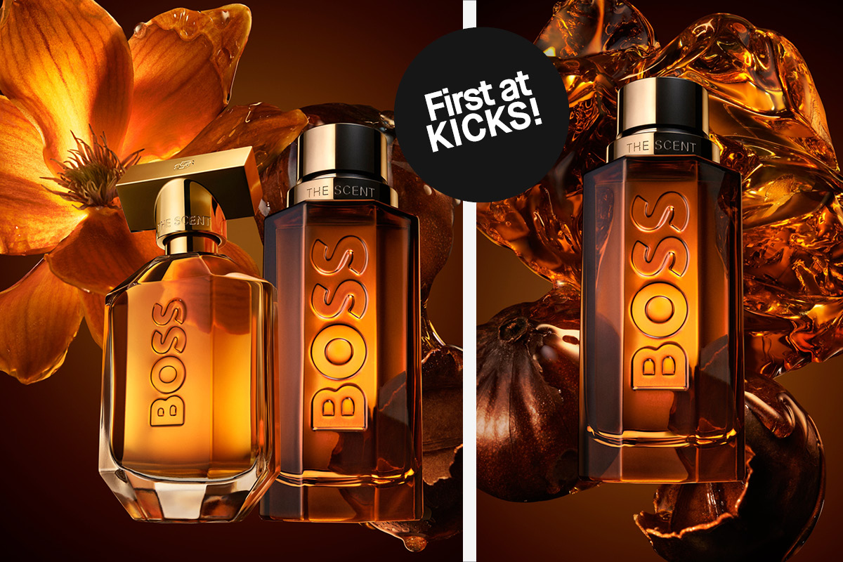 Två Boss The Scent-parfymflaskor framför en orange blomma, med texten First at KICKS!