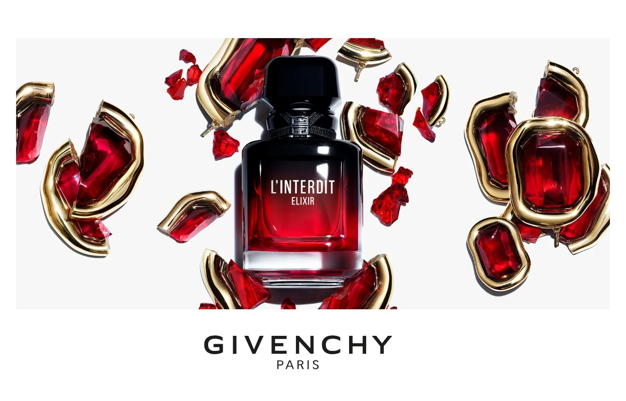 Givenchy L’Interdit Elixir-parfym omgiven av röda och gyllene detaljer.