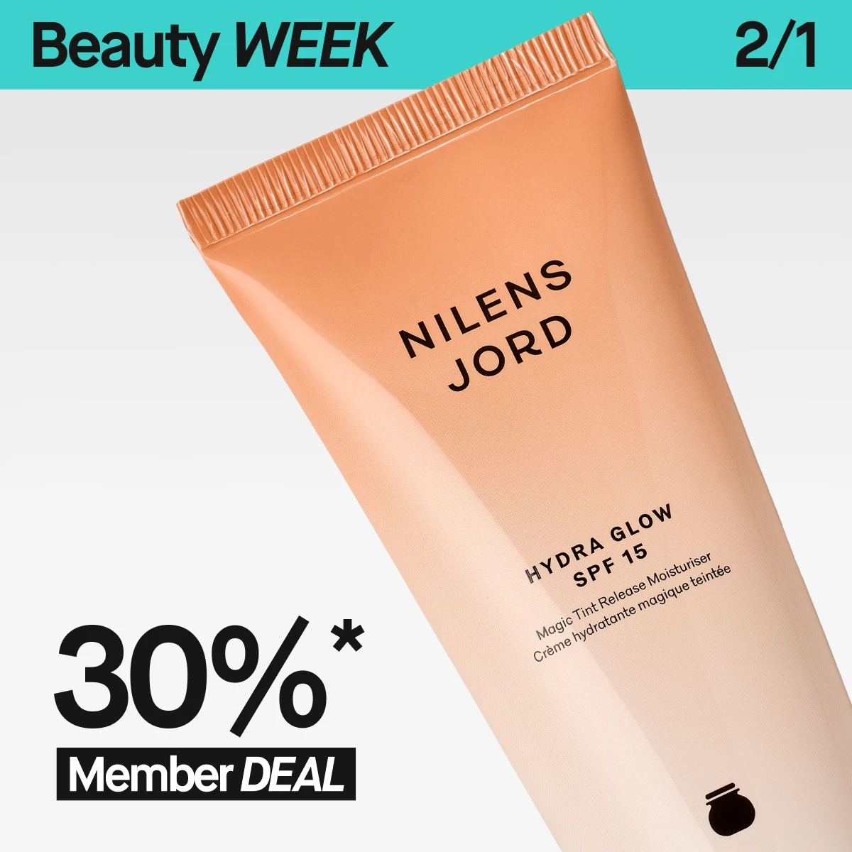 En närbild på Nilens Jord Hydra Glow SPF 15 i beige tub, lutad mot en ljus bakgrund. Ovanför syns en turkos banner med ”Beauty WEEK” och 2/1. I nederkanten står texten ”30%* Member DEAL”.