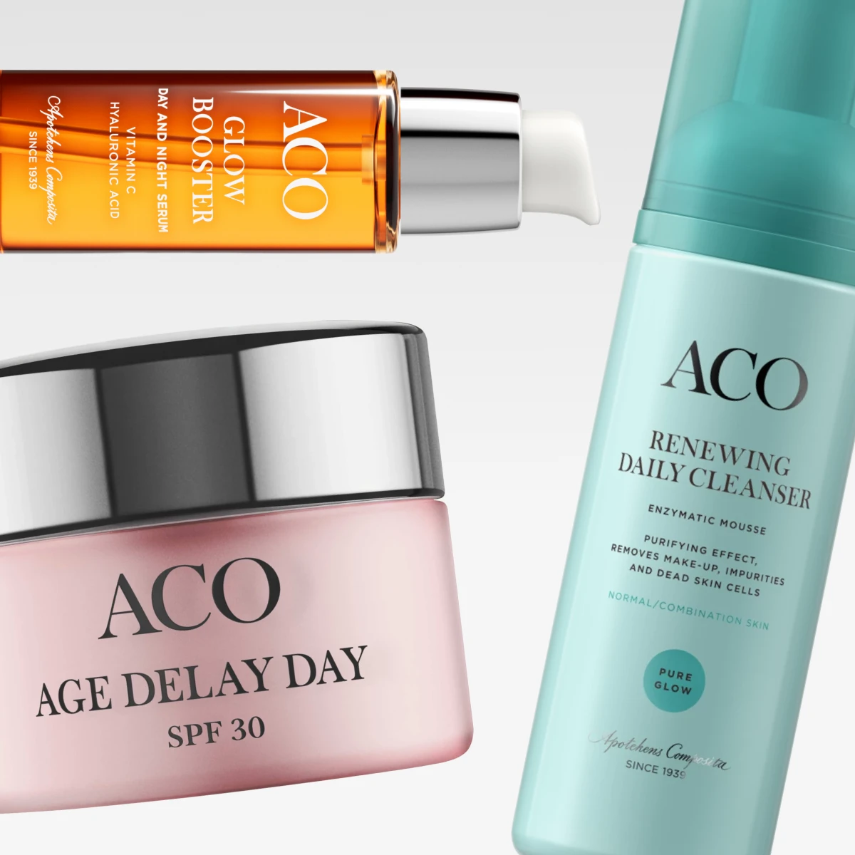 Bild som visar tre ACO produkter: en orange flaska med ACO Glow Booster Day and Night Serum, en rosa burk med ACO Age Delay Day SPF 30, och en turkos flaska med ACO Renewing Daily Cleanser. Bakgrunden är vit.