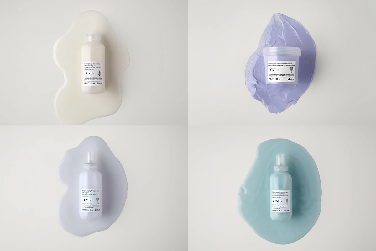 Fyra Davines hårvårdsprodukter från serierna LOVE och MINU visas mot vit bakgrund med utstrukna produkttexturer i vitt, ljuslila, turkos och lila bakom förpackningarna. Bilden innehåller schampo, hårmask och hårvårdsprodukter med synliga etiketter där “LOVE/”, “MINU/” och Davines-logotypen framgår.
