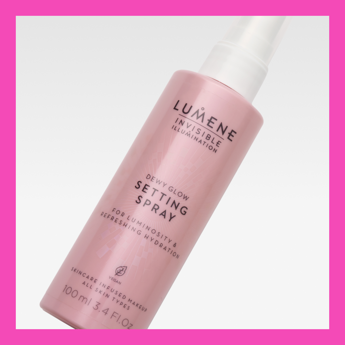 umenen setting spray nimeltä "Dewy Glow Setting Spray". Pullo on vaaleanpunainen, jossa on valkoinen teksti ja valkoinen spraykorkki.