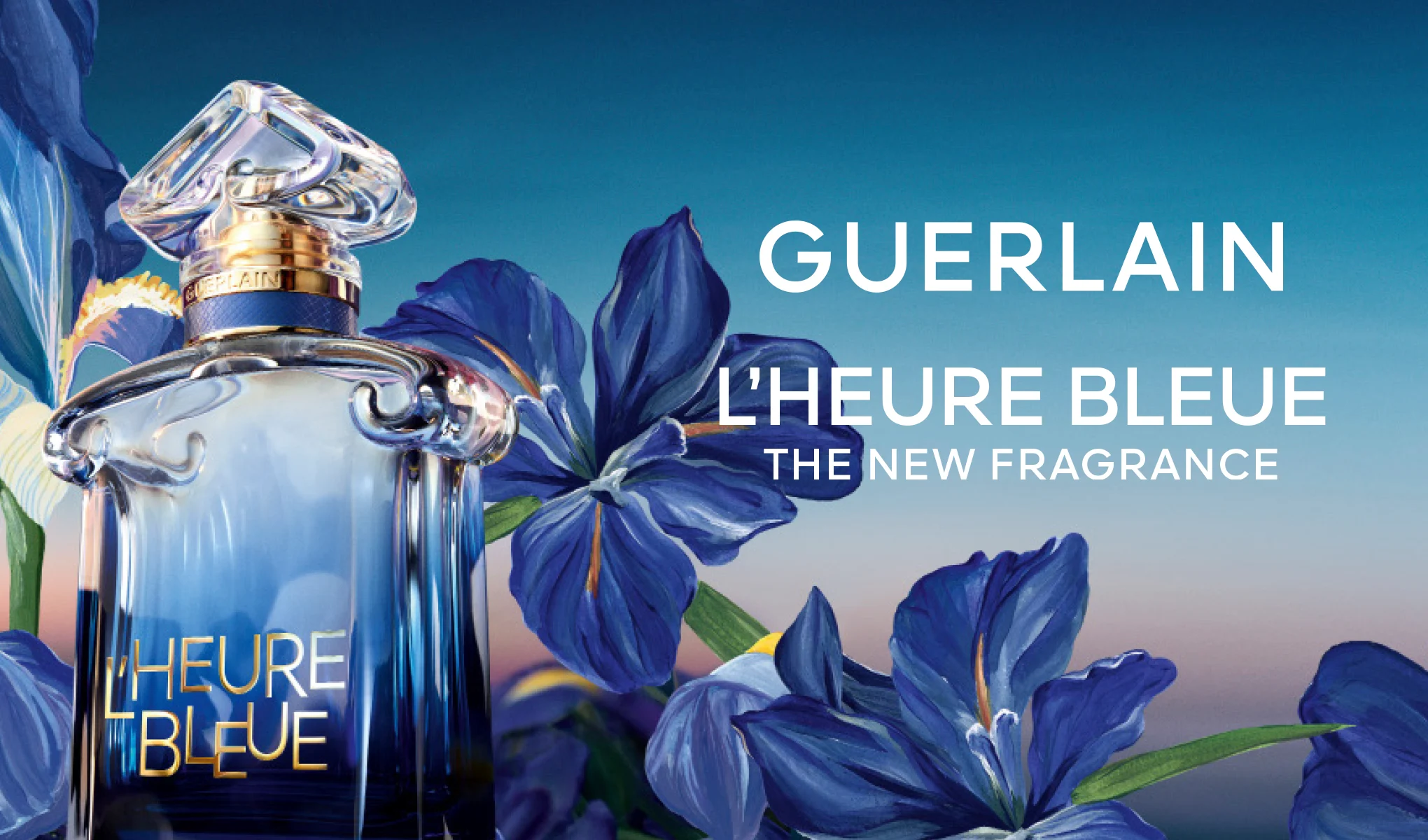Guerlain L’Heure Bleue-parfymeflaske blant blå iriser. Tekst: «Guerlain L’Heure Bleue. The new fragrance.»