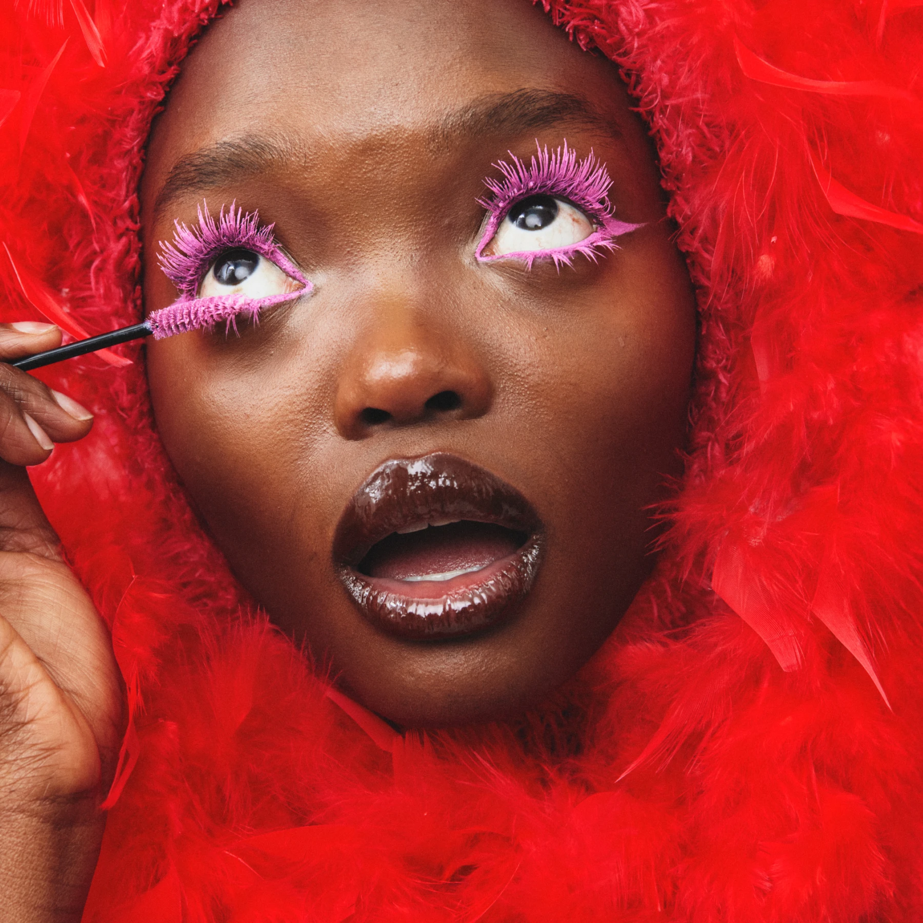 Makeup red woman feathers 