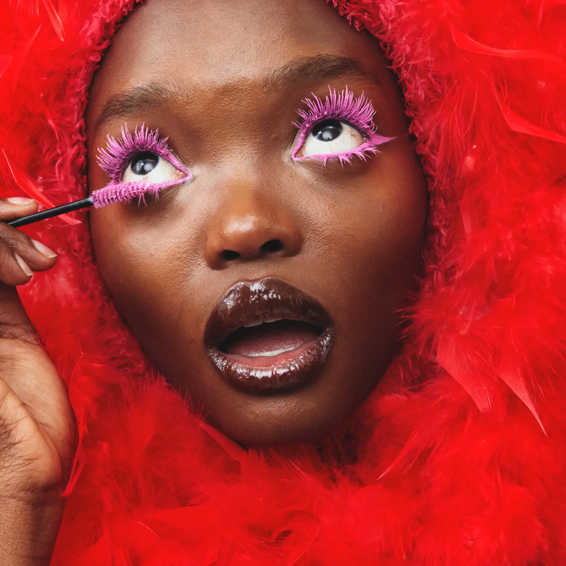 Makeup red woman feathers 