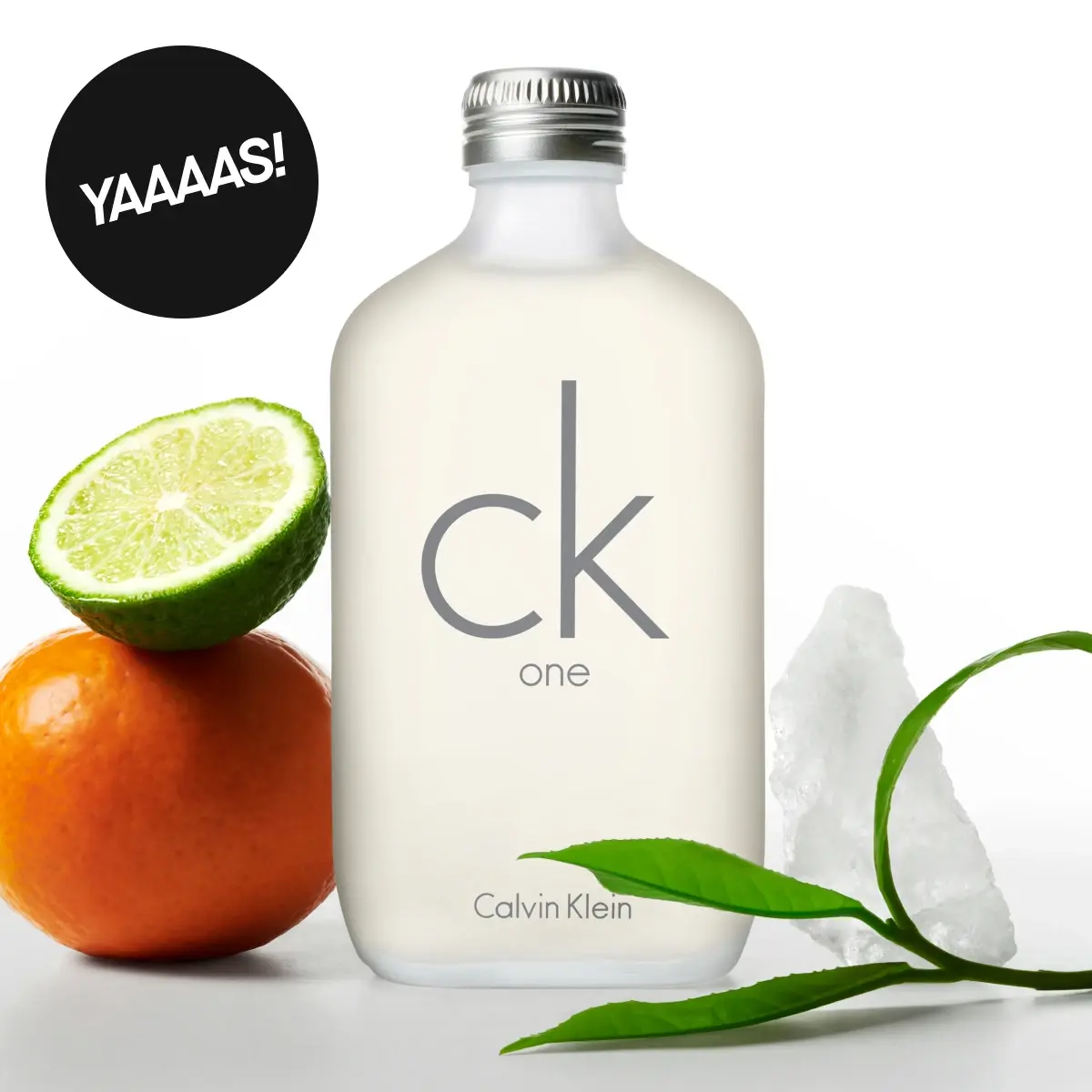 Calvin Klein ck one parfymeflaske med lime, appelsin, grønne blader og krystaller. Tekst leser 'YAAAAS!'