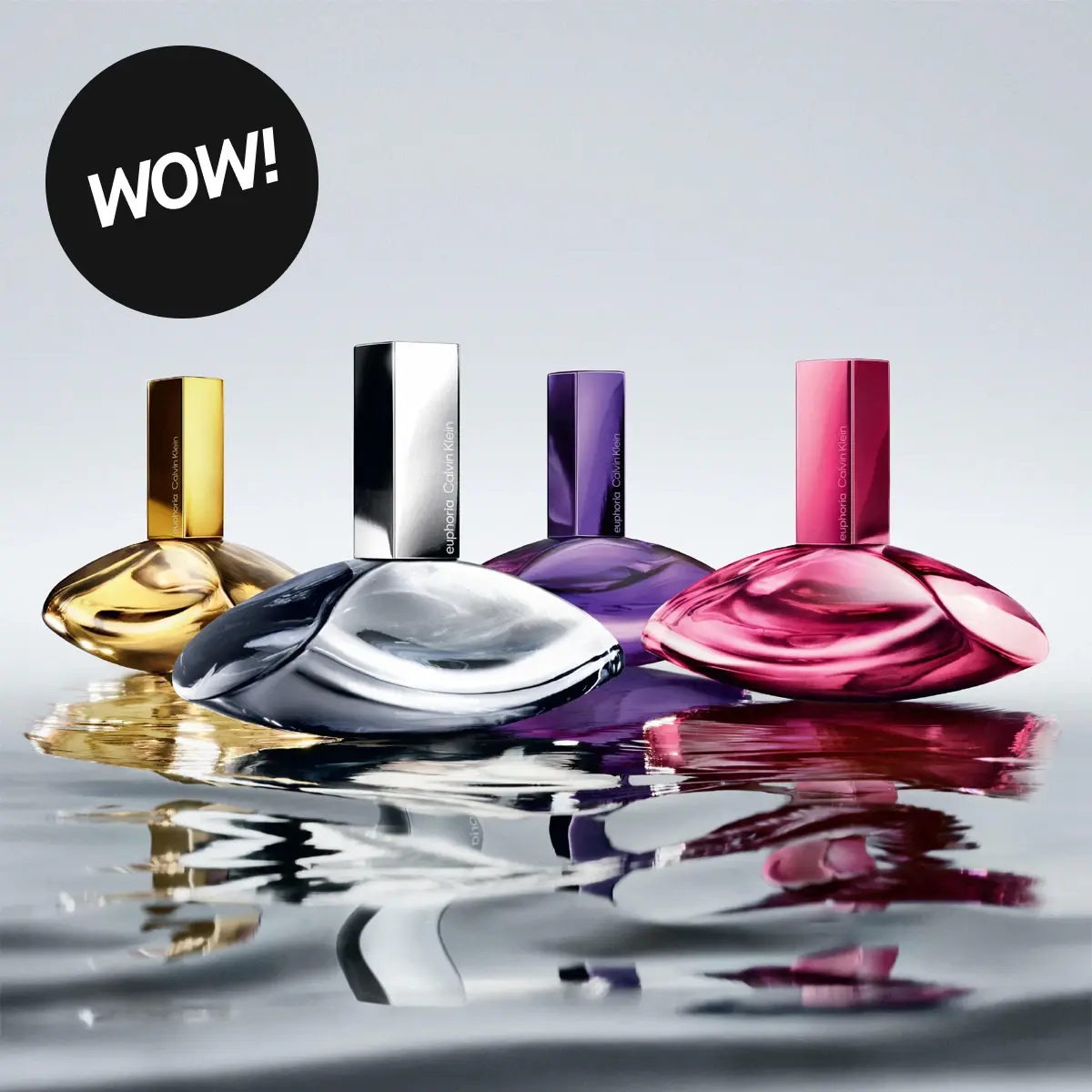 Calvin Klein euphoria parfymflaskor: guld, silver, lila, fuchsia, på en reflekterande yta. Text: WOW!, euphoria Calvin Klein.
