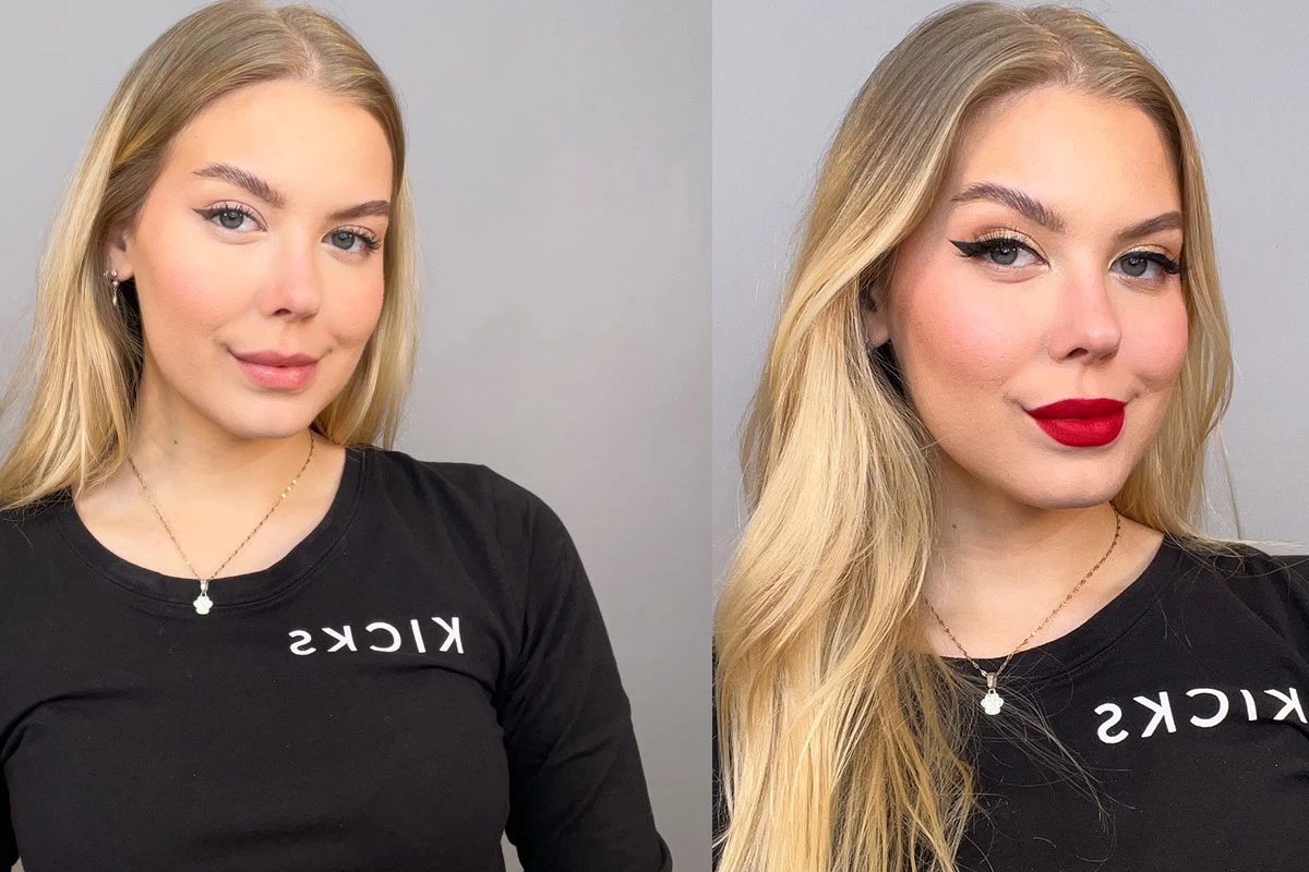 En närbild på en person med långt blont hår som bär en svart tröja med texten "KICKS" mot en grå bakgrund.