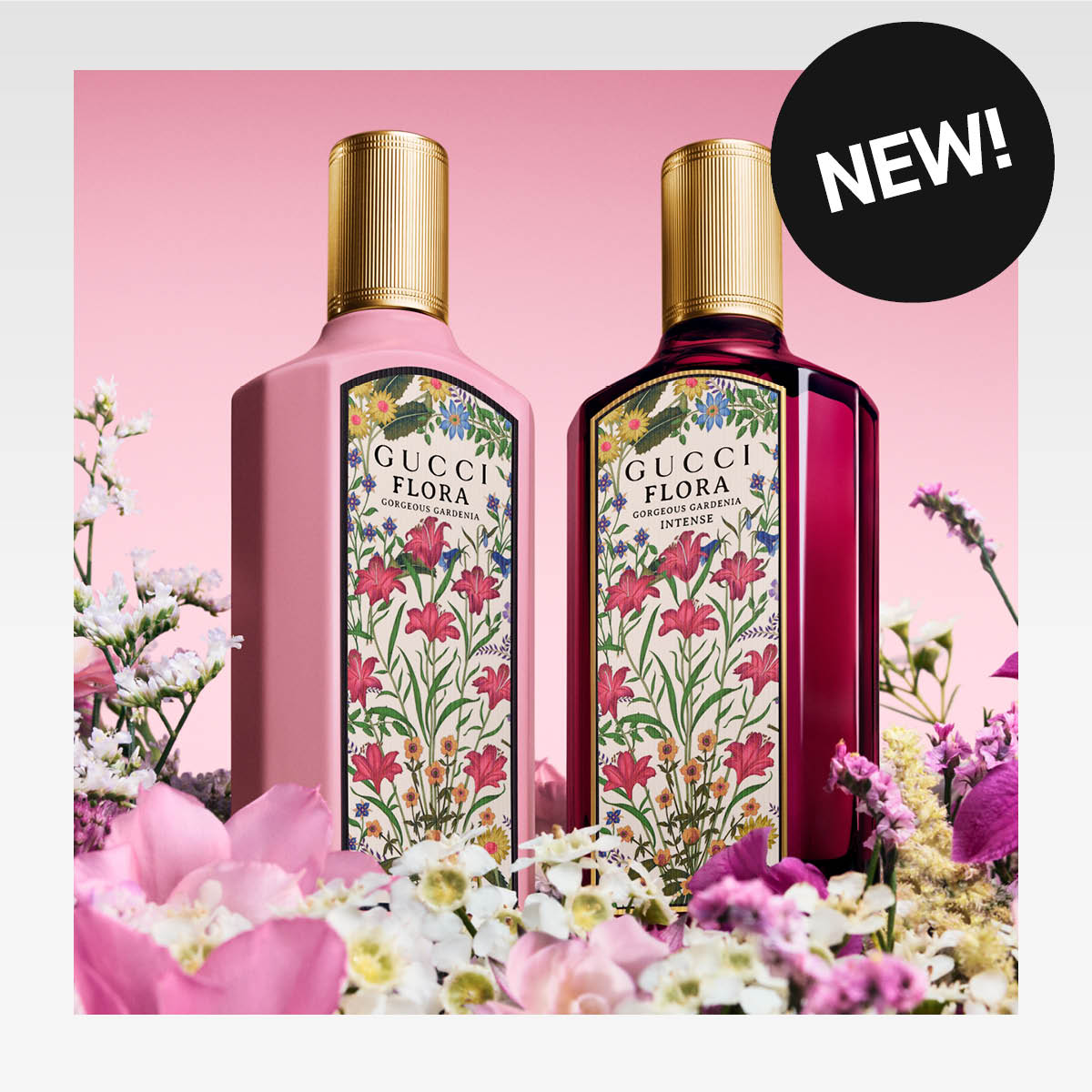 Kaksi Gucci Flora Gorgeous Gardenia -hajuvesipulloa kukkien keskellä, merkitty uutuutena.