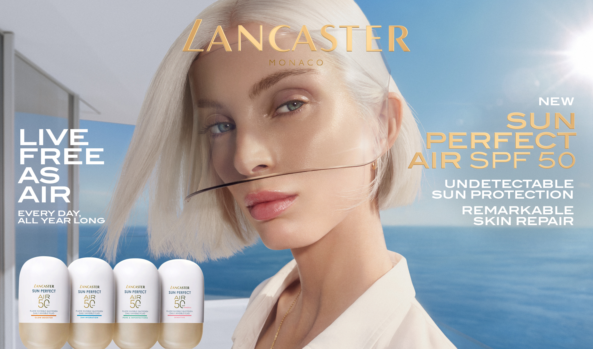 Lancaster Monaco -kampanjakuva, jossa henkilö meren ja sinisen taivaan edessä sekä neljä aurinkosuojatuotetta “Sun Perfect Air SPF 50”. Kuvassa näkyvät tekstit “LANCASTER MONACO”, “LIVE FREE AS AIR”, “EVERY DAY, ALL YEAR LONG”, “NEW SUN PERFECT AIR SPF 50”, “UNDETECTABLE SUN PROTECTION” ja “REMARKABLE SKIN REPAIR”.