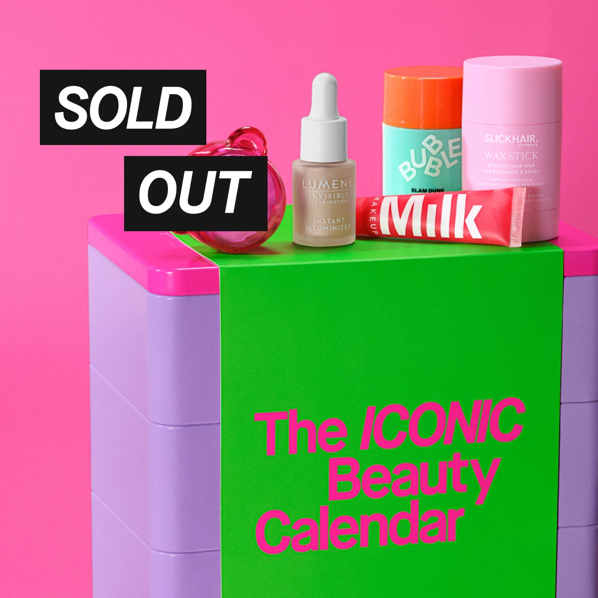 Erilaisia kauneustuotteita värikkäällä laatikolla. Teksti 'SOLD OUT' ja 'The ICONIC Beauty Calendar'.