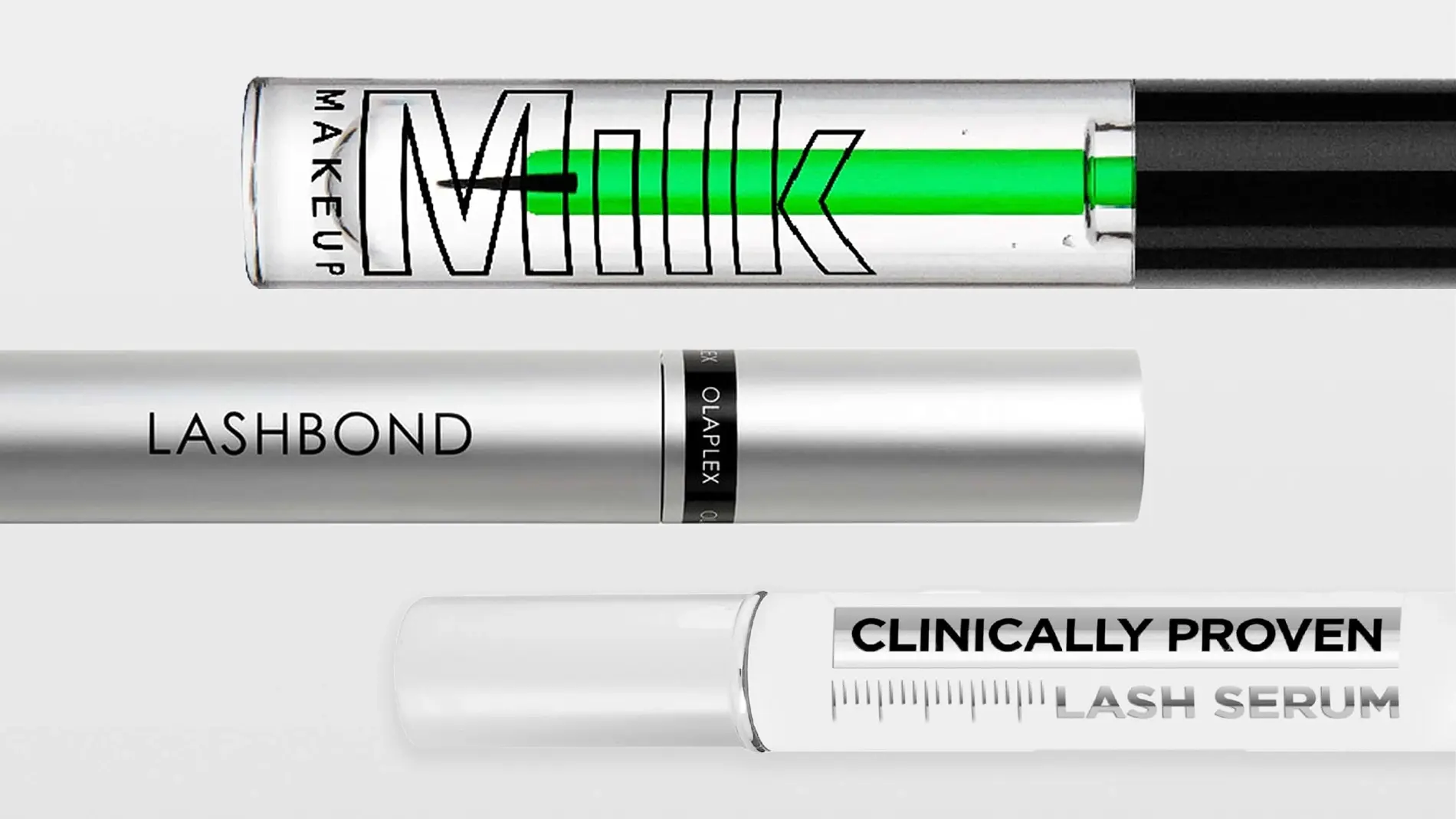 Lähikuva ripsiseerumista ja ripsiväristä merkeiltä Olaplex ja Milk Makeup; pakkauksissa tekstit "Milk Makeup", "LASHBOND", "OLAPLEX" ja "CLINICALLY PROVEN LASH SERUM" läpinäkyvässä ja valkoisessa designissa.