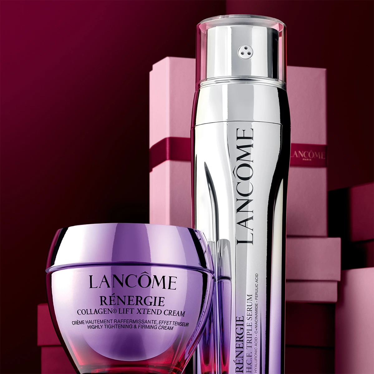 Lancôme Rénergie sett med en lilla krukke og en sølvfarget flaske. Rosa gaveesker i bakgrunnen.