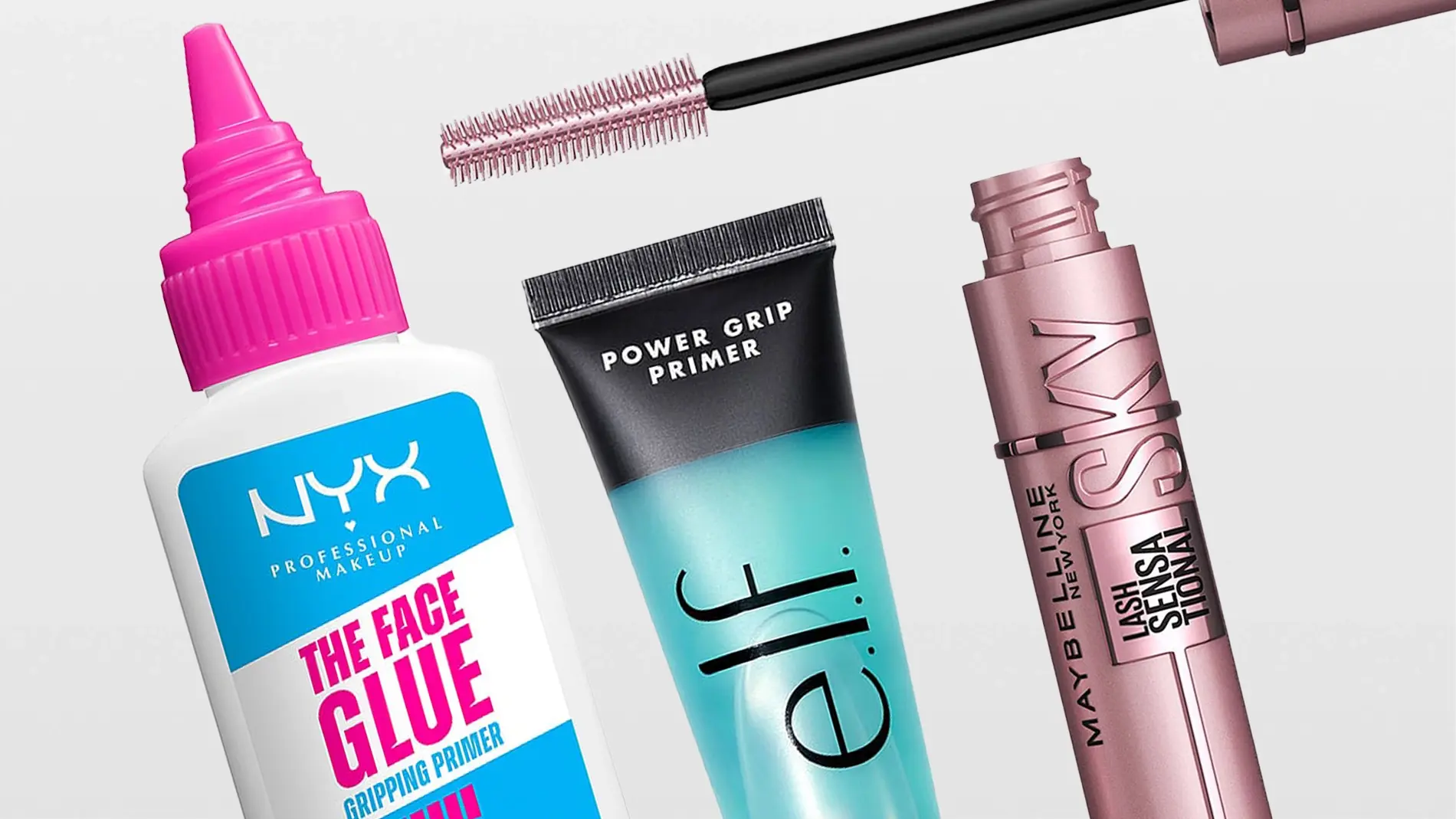 Lähikuva kolmesta meikkituotteesta vaaleanharmaata taustaa vasten: NYX Professional Makeup The Face Glue Gripping Primer, e.l.f. Power Grip Primer ja Maybelline New York Lash Sensational Sky High -ripsiväri, jonka harja on näkyvissä. Pakkauksissa näkyvät selkeästi tekstit ”NYX Professional Makeup”, ”The Face Glue Gripping Primer”, ”Power Grip Primer”, ”e.l.f.”, ”Maybelline New York”, ”Lash Sensational” ja ”Sky High”.