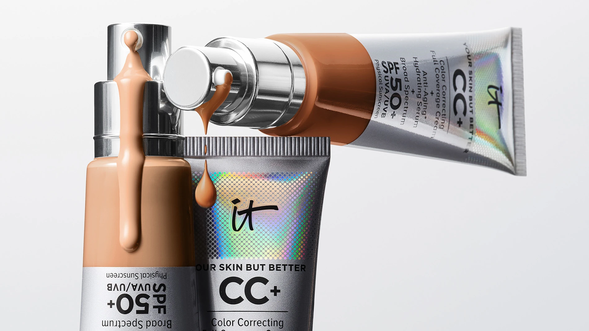 Kolme CC-voidetta SPF 50+ -suojakertoimella tyylikkäässä, metallisessa pakkauksessa, jossa CC-voide valuu pumpuista.