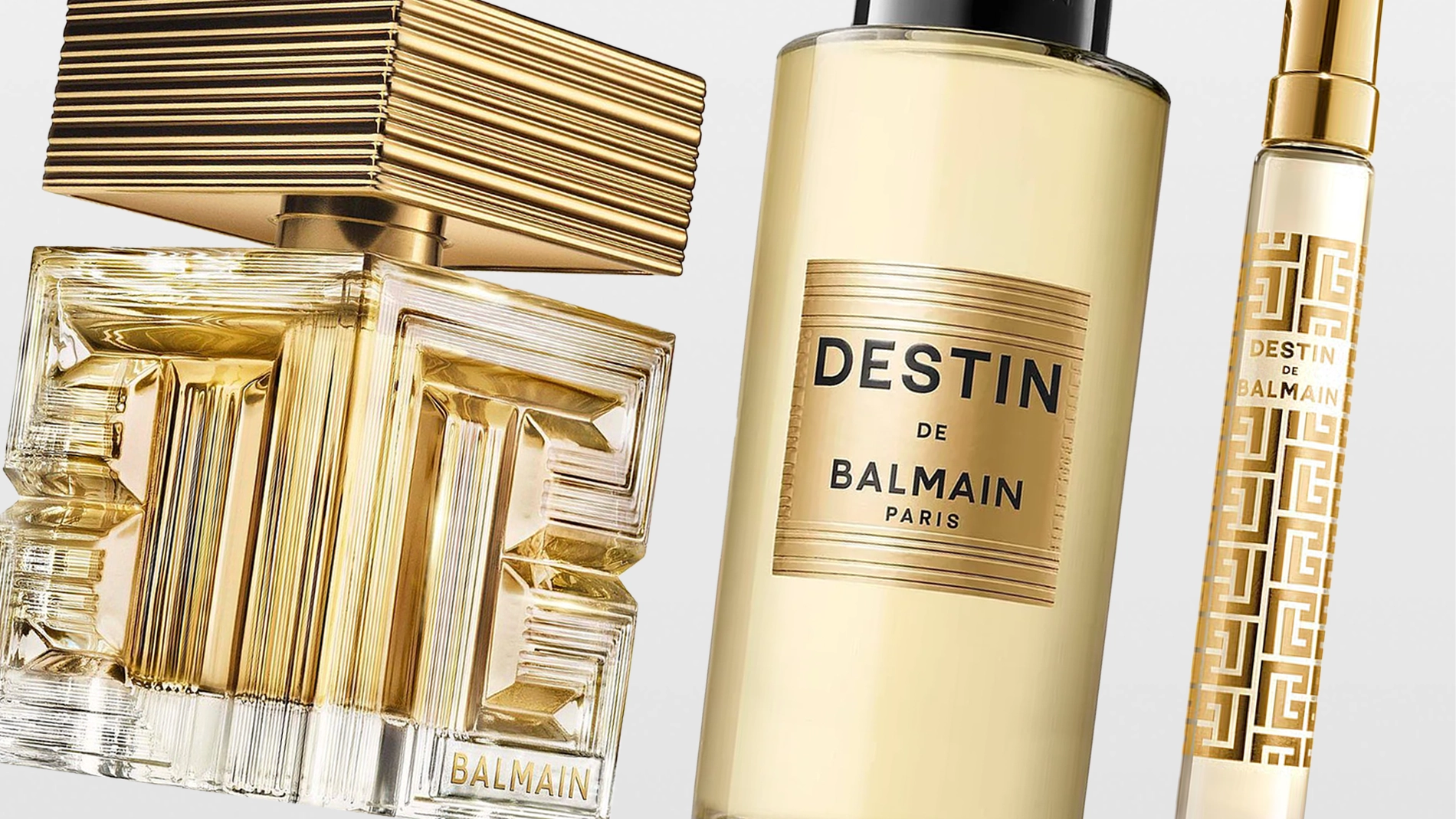 Tre parfymflaskor från Balmain, inklusive DESTIN DE BALMAIN PARIS, i guldfärgad design med dekorativa detaljer och transparent glas. Fokus på lyxig parfym, glasflaskor och guldfinish mot ljus bakgrund.