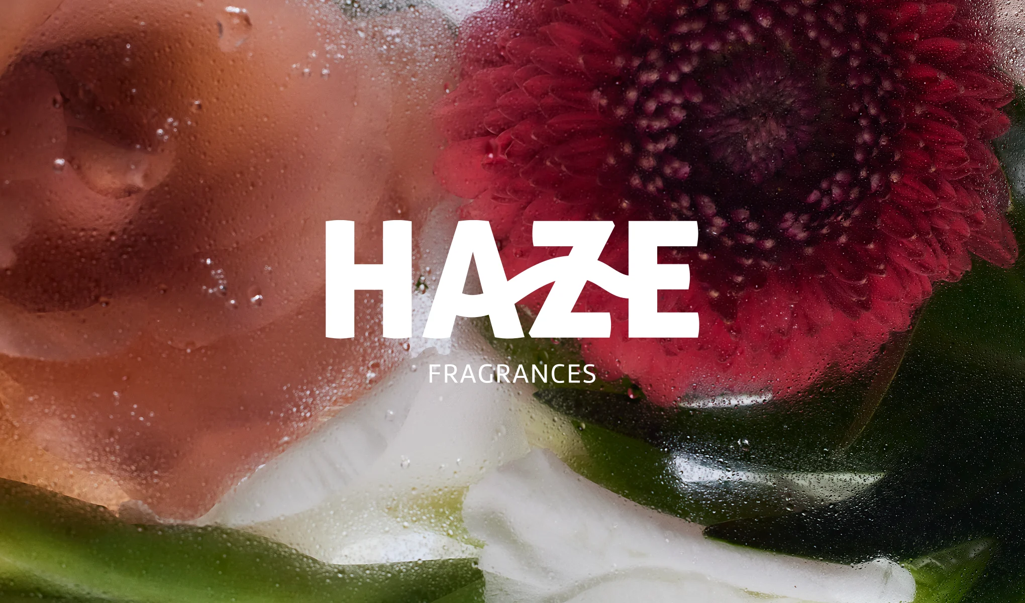 Kuva, jossa on vesipisaroita ja kukkia. Teksti: "HAZE HAIR AND ALL OVER BODY MISTS".