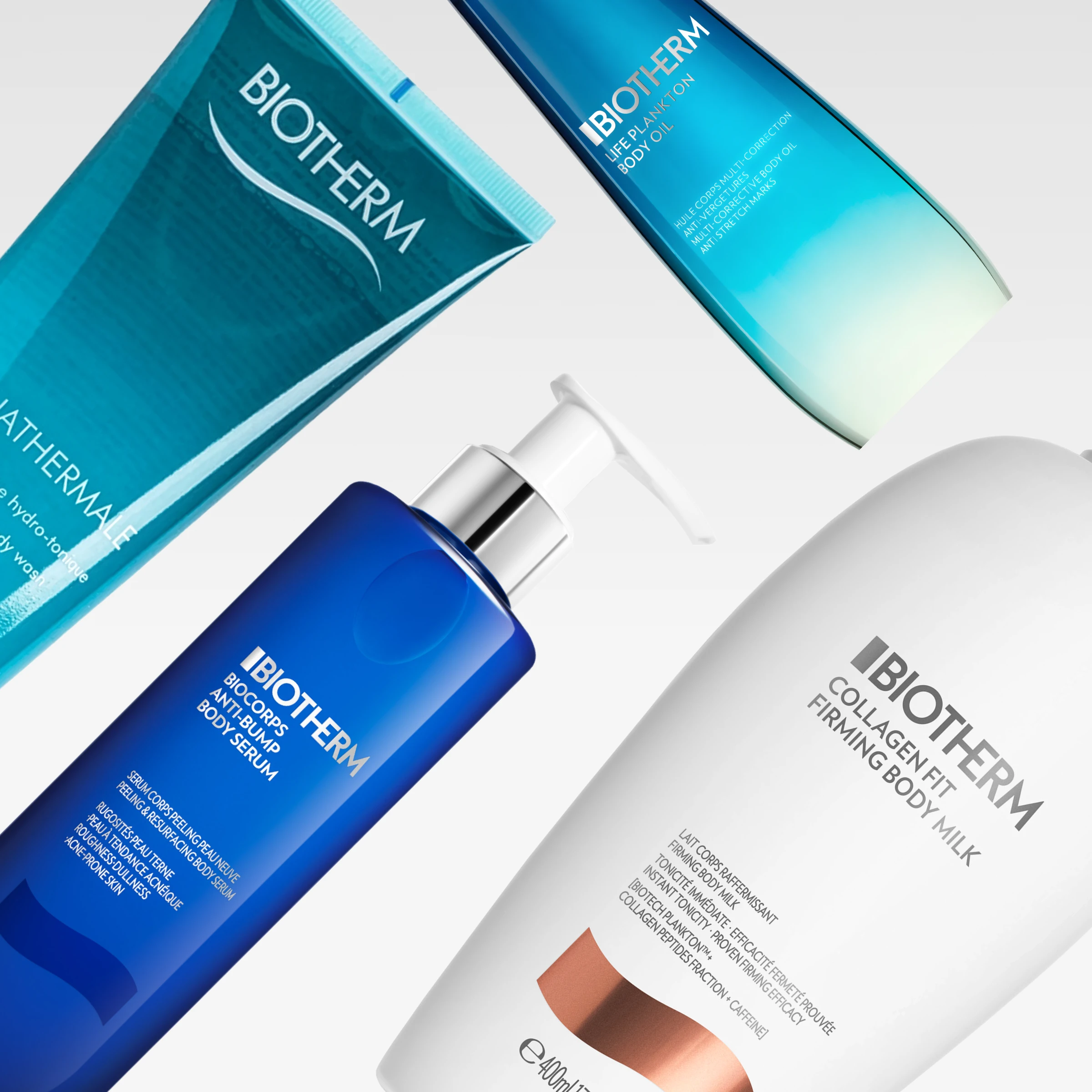 Biotherm-vartalonhoitotuotteita vaaleanharmaata taustaa vasten sinisissä ja valkoisissa pakkauksissa. Kuvassa näkyy tuotteita teksteillä “Lait Corporel”, “Life Plankton Body Oil”, “Biocorps Anti-Bump Body Serum” ja “Collagen Fit Firming Body Milk”.