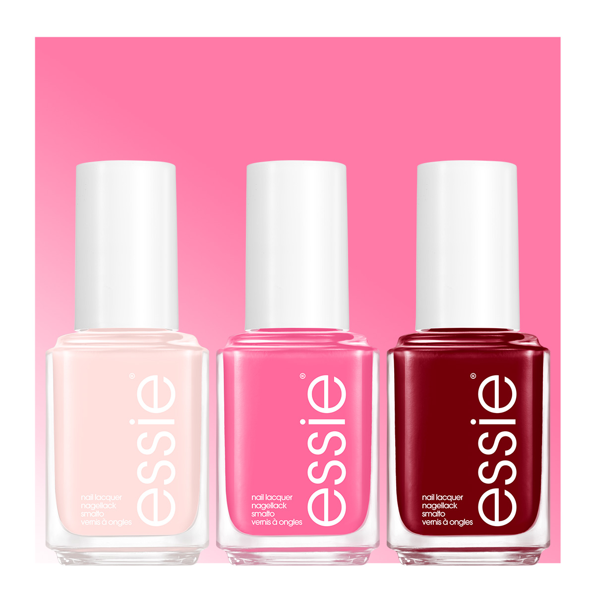 Tre Essie-nagellacksflaskor mot rosa bakgrund. Från vänster till höger: ljusrosa, klarrosa och mörkröd nagellack.
