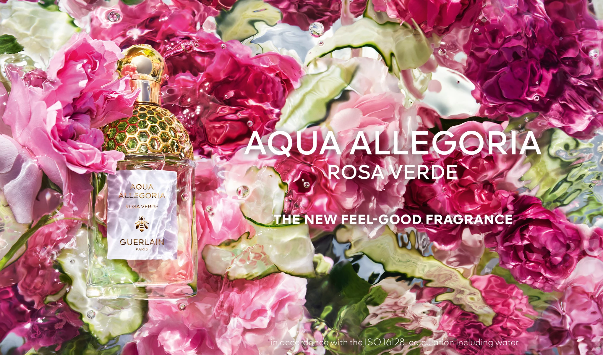 Aqua Allegoria Rosa Verde, en ny velduftende parfyme, presentert blant fargerike blomster.