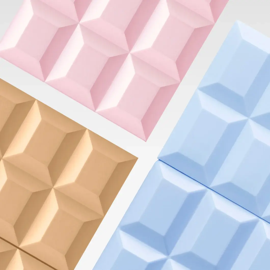 Geometriska, präglade ytor i rosa, ljusblått och beige, som liknar segment av chokladkakor.