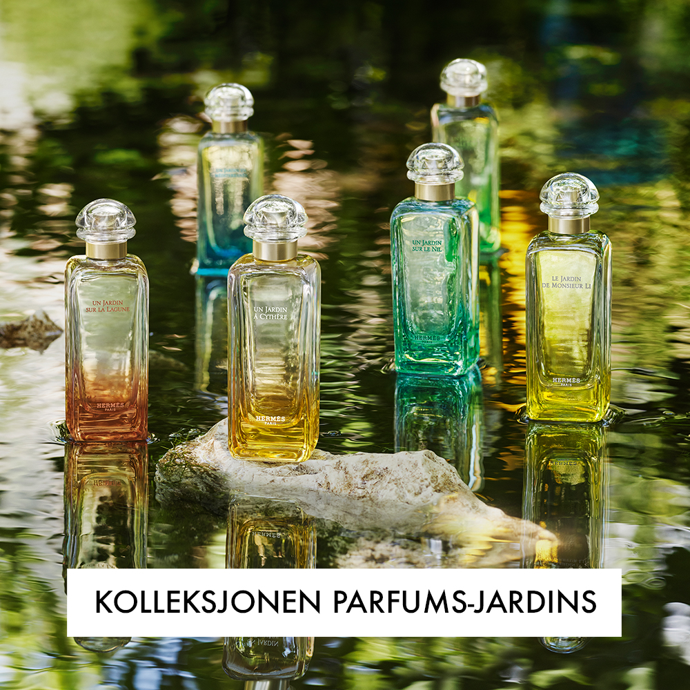 Flere parfymeflasker fra Hermès, plassert i en naturlig vannkilde. Flaskene tilhører kolleksjonen Parfums-Jardins, og teksten "Kolleksjonen Parfums-Jardins" vises nederst.
