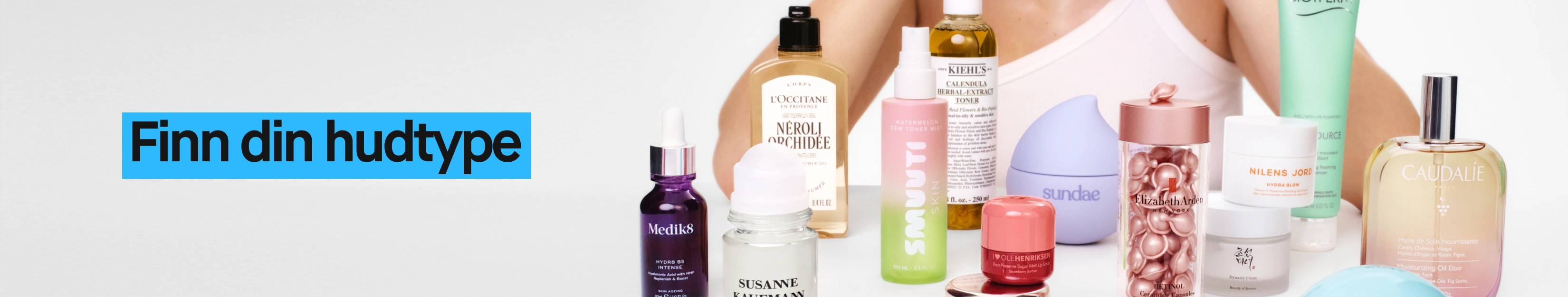 Hudpleieprodukter fra flere merker med teksten “Finn hudtypen din” i blå boks.