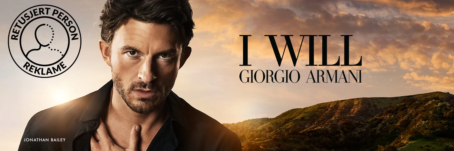 Mann i kampanjebilde for Giorgio Armani I Will i solnedgangen.