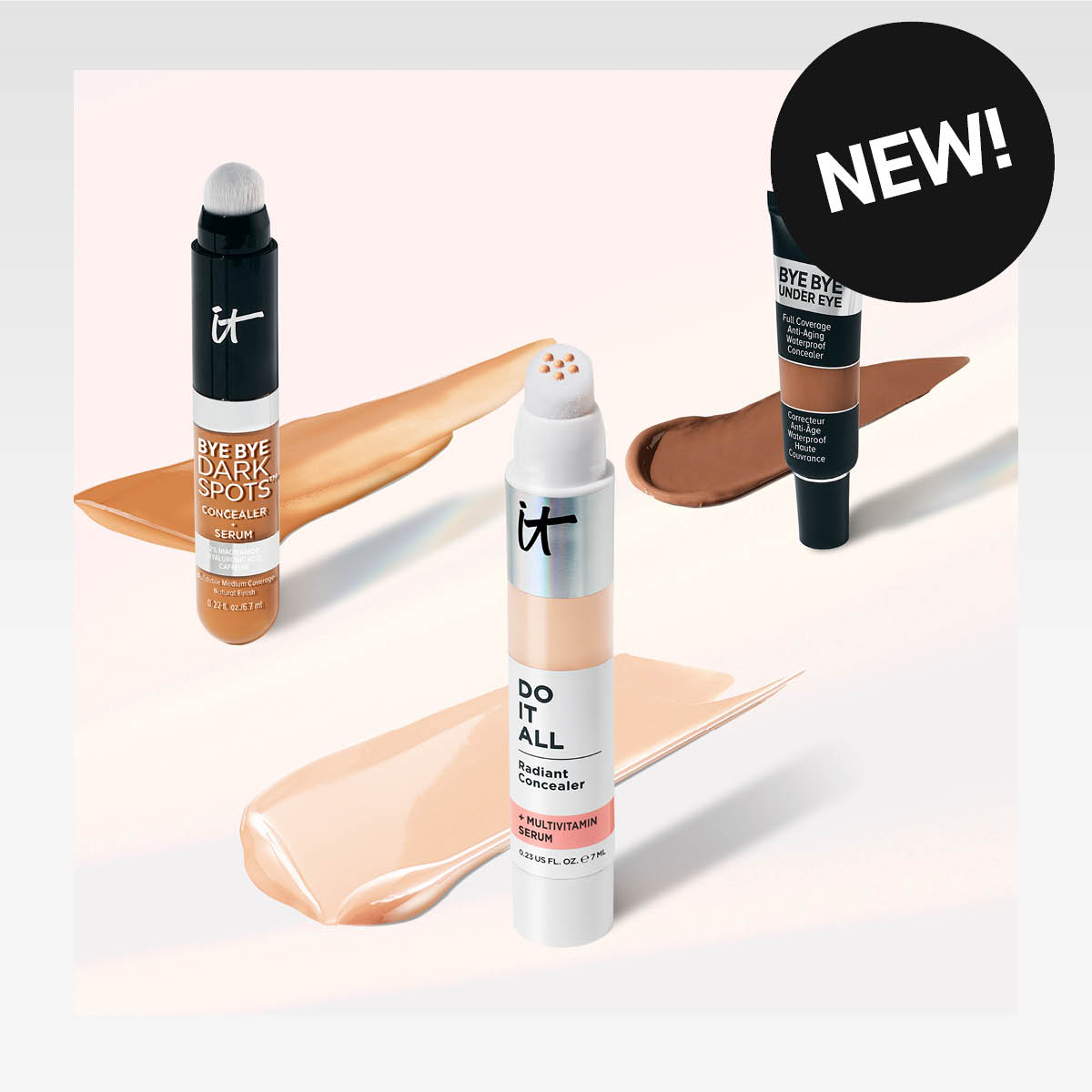 Uusi IT Cosmetics peitevoidevalikoima, joka sisältää Bye Bye Dark Spots, Bye Bye Under Eye ja Do It All Radiant Concealer. Tuotteet ovat eri sävyisiä ja niissä on vaaleanpunainen tausta.