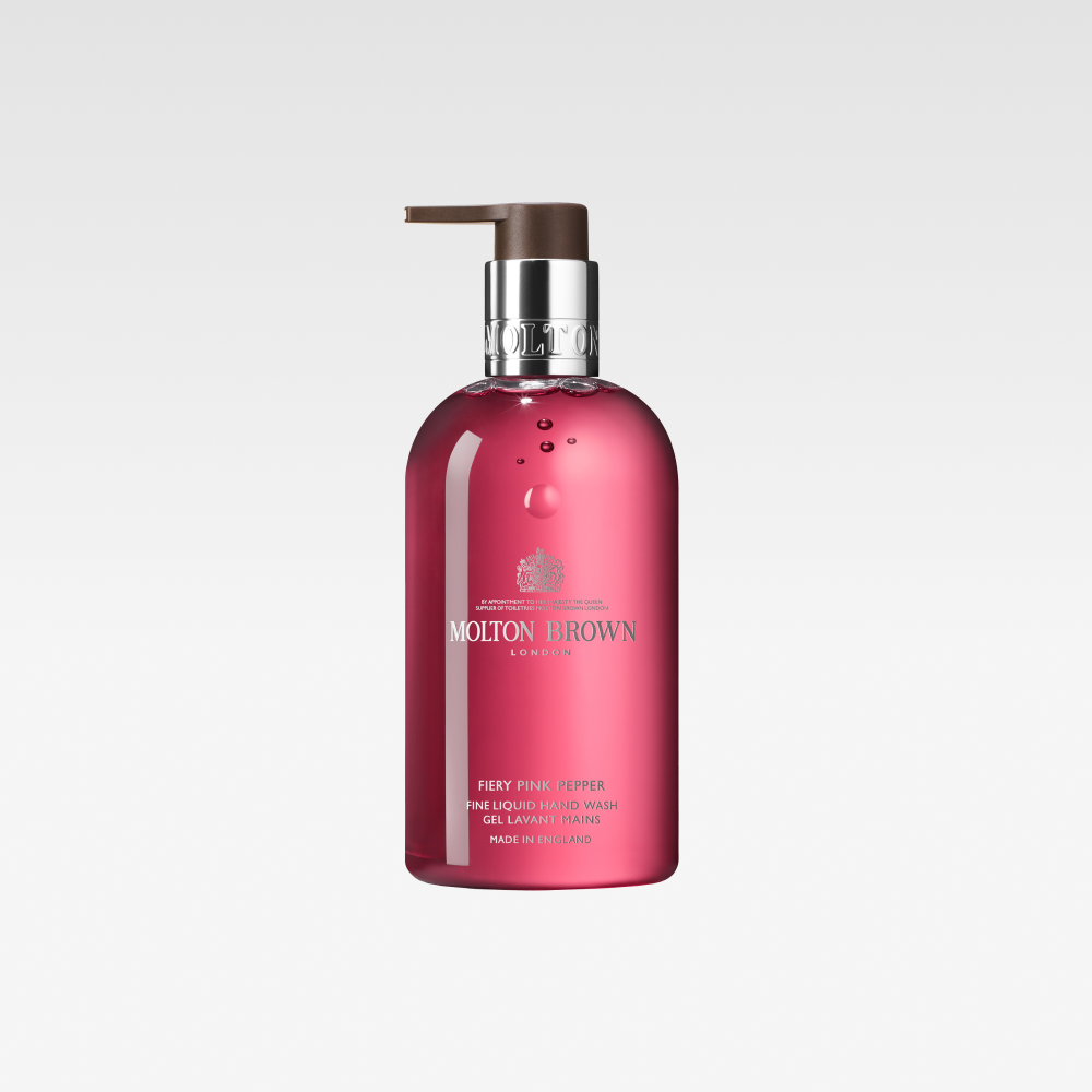 Rosa pumpeflaske fra Molton Brown mot en hvit bakgrunn