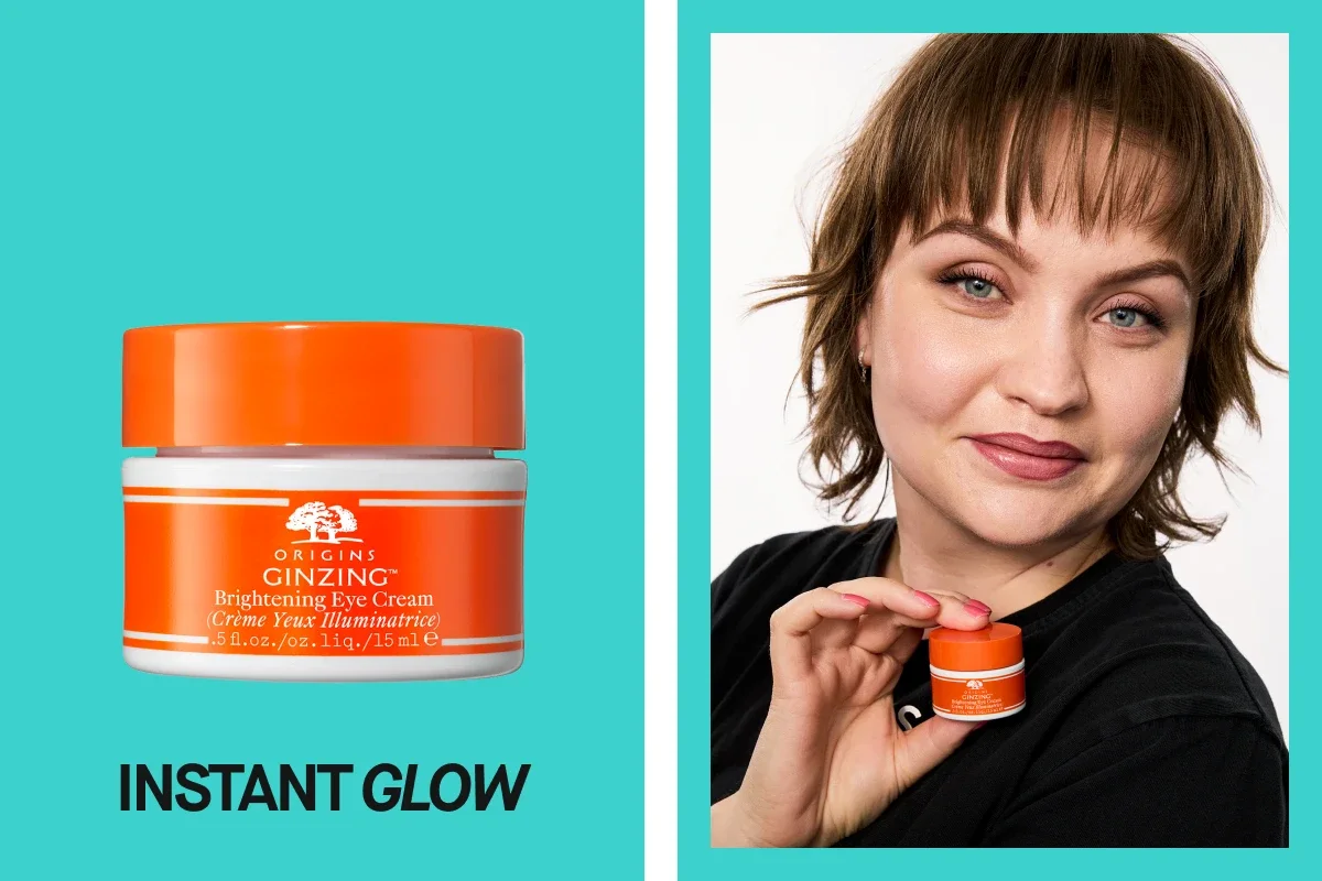 Kuva Origins GinZing Brightening Eye Cream -silmänympärysvoiteesta ja henkilöstä, joka pitää voidetta kädessään. Teksti "INSTANT GLOW".