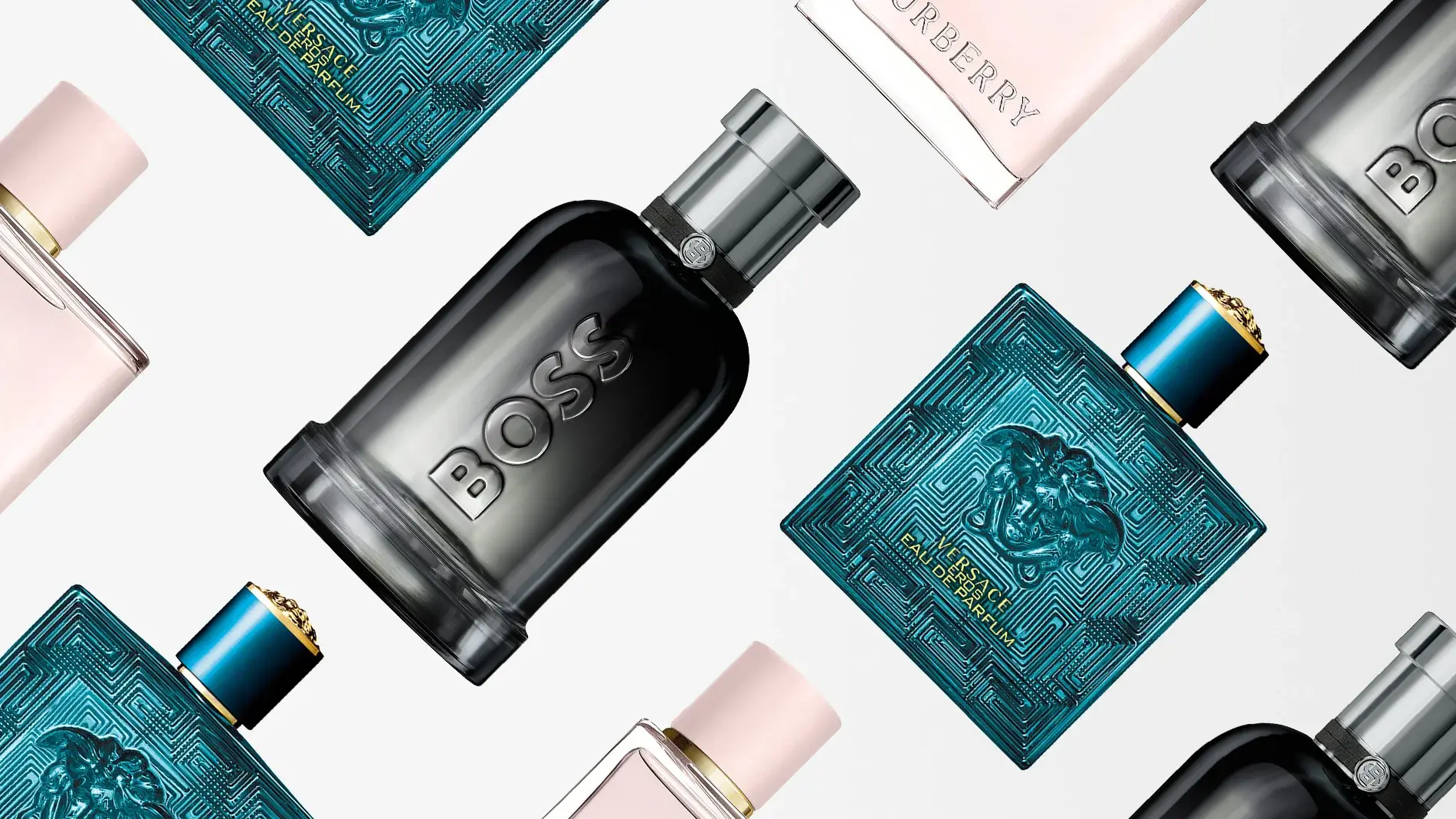 Useita ylellisiä hajuvesipulloja brändeiltä kuten Hugo Boss, Versace ja Burberry on aseteltu vaalealle taustalle. Kuvassa on tuoksuja sekä miehille että naisille tyylikkäissä mustissa, turkooseissa ja vaaleanpunaisissa pulloissa. Kuva viestii luksusta, tyyliä ja yksilöllistä tuoksua.