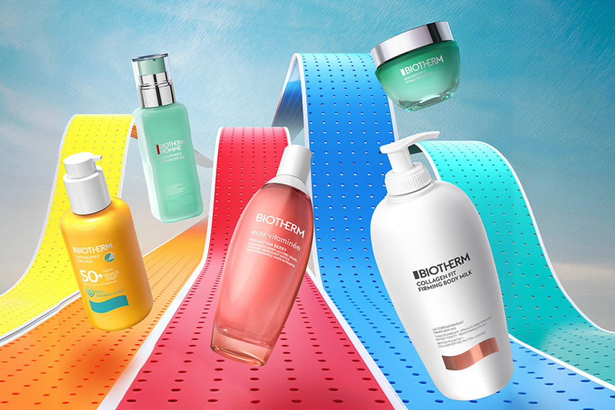 Biotherm-kampanjakuva ihonhoito- ja vartalonhoitotuotteista värikkäällä taustalla, jossa näkyy aaltoilevia nauhoja keltaisen, punaisen, sinisen ja turkoosin sävyissä sekä teksti “WOW!”. Kuvassa ovat Biotherm Waterlover SPF 50+ aurinkosuoja, Homme Aquapower Advanced Gel, Eau Vitaminée vartalosuihke, Collagen Fit Firming Body Milk sekä Biothermin kasvovoidepurkki.