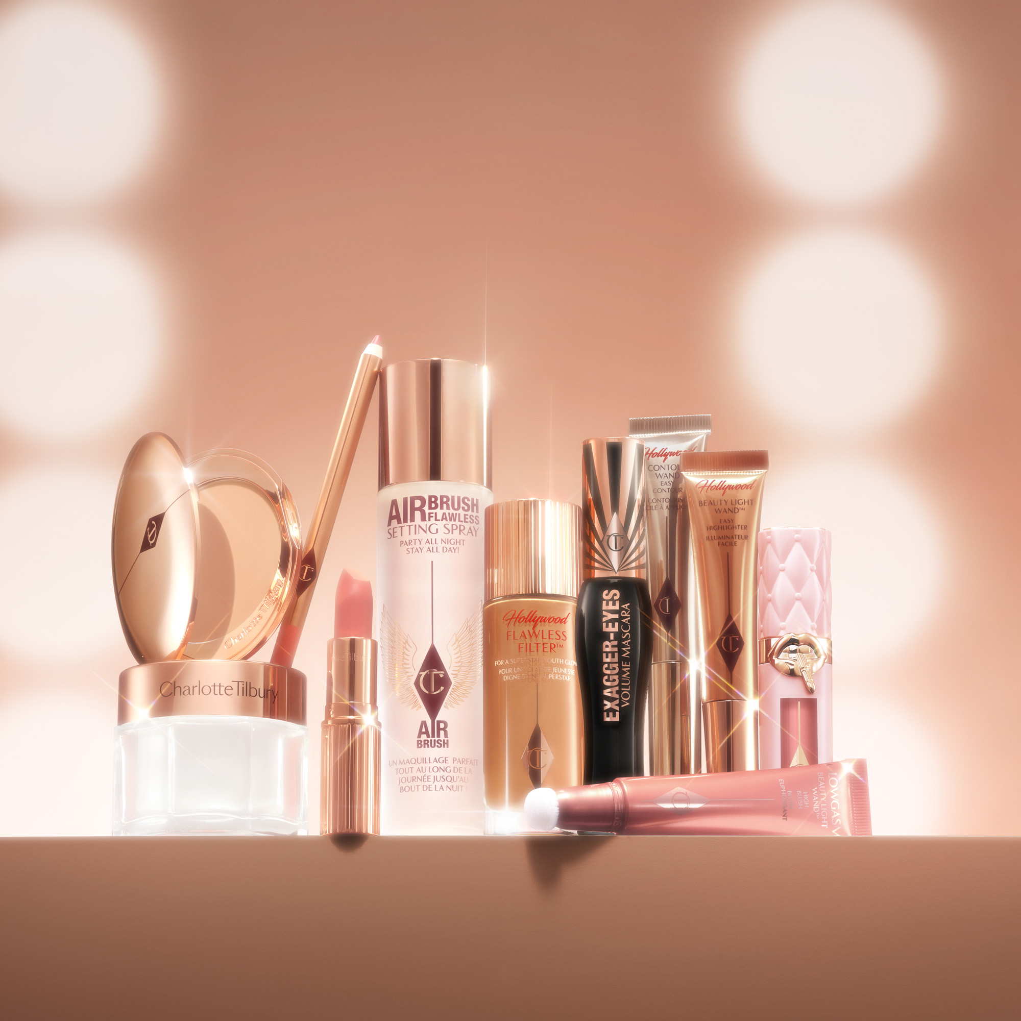 Charlotte Tilbury sminkprodukter, inklusive fuktkräm, läppstift, setting spray, concealer, mascara och läppglans.