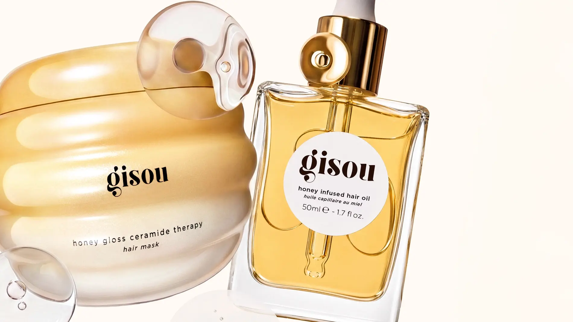 Kaksi Gisou-hunajatuotetta: hunajakiiltokeramiditerapiahiusnaamio ja hunajapohjainen hiusöljy, 50ml.
