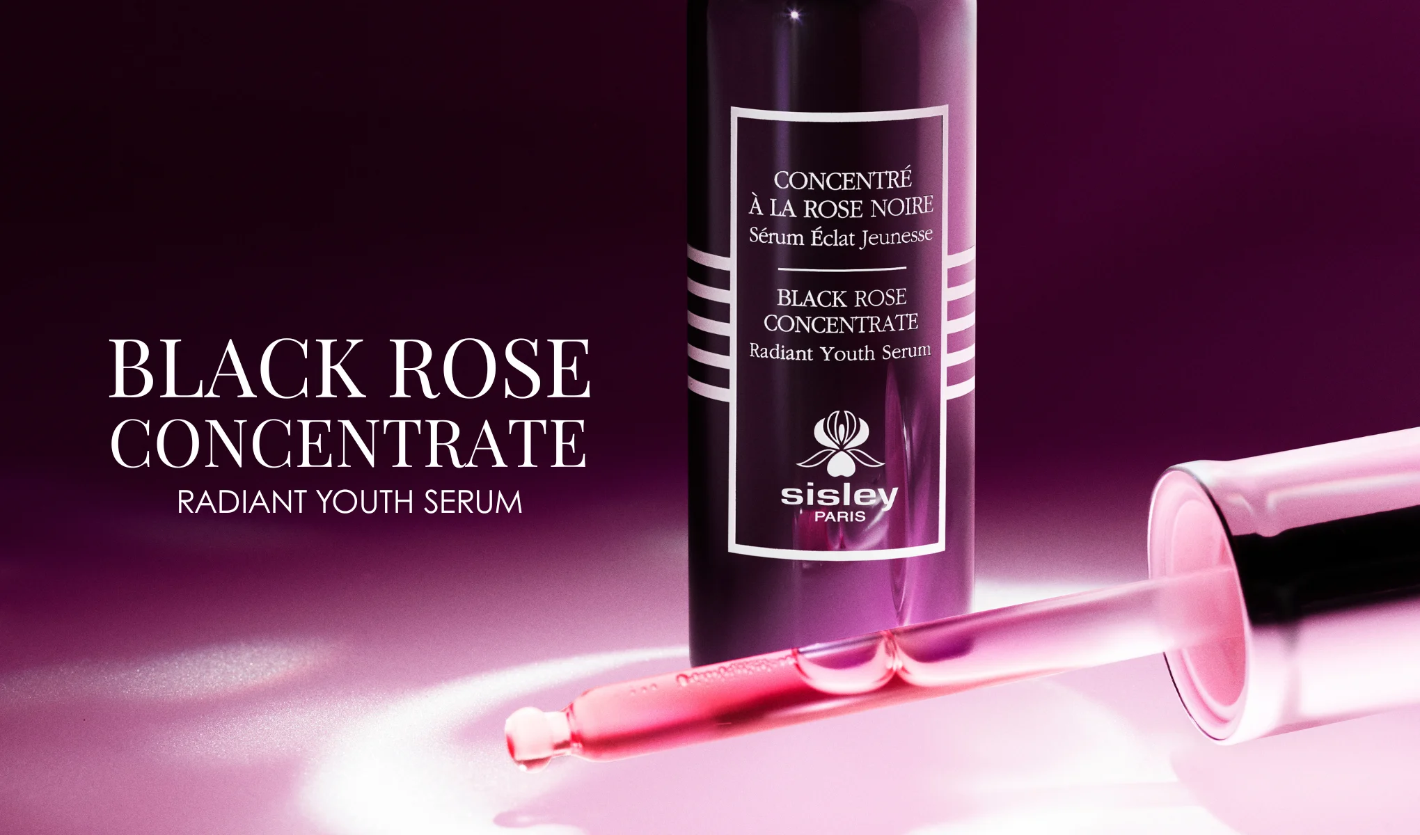 Flaske og pipette med Sisley Black Rose Concentrate Radiant Youth Serum med rosa serum, mot en lilla bakgrunn med produktnavnet i tekst.