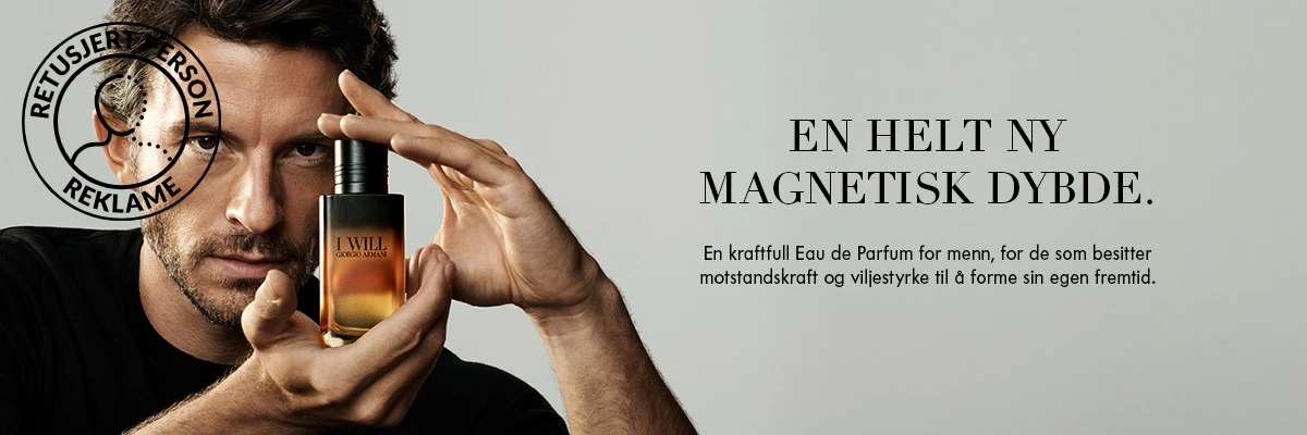 Mann holder Giorgio Armani I Will-parfymeflasken. Tekst: «En aldri tidligere skapt magnetisk dybde. En kraftfull Eau de Parfum for menn med motstandskraft og viljestyrke til å forme sin egen skjebne.»