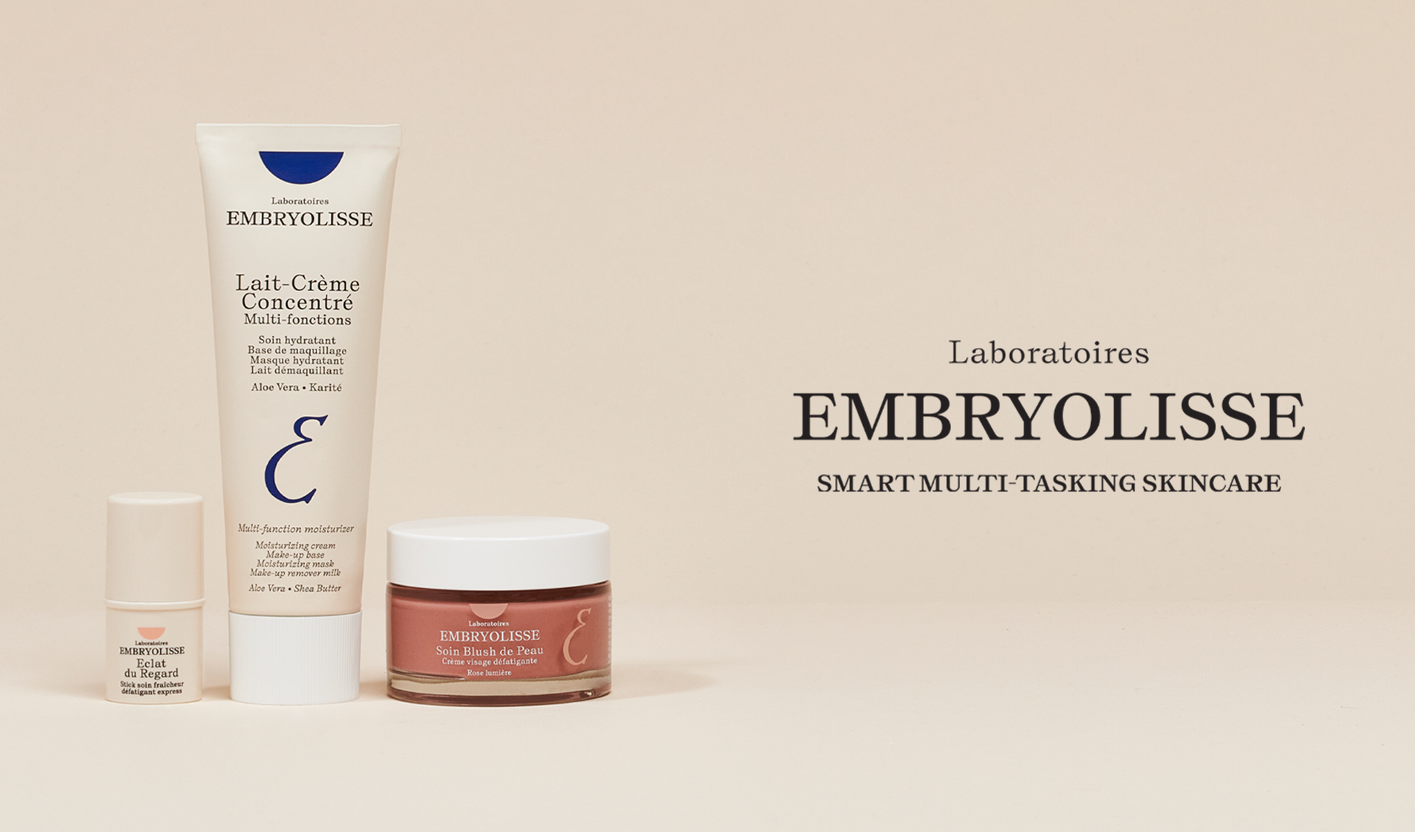Kolme Laboratoires Embryolissen ihonhoitotuotetta beigeä taustaa vasten ja teksti ”Laboratoires Embryolisse Smart Multi-Tasking Skincare” tuotteiden oikealla puolella.