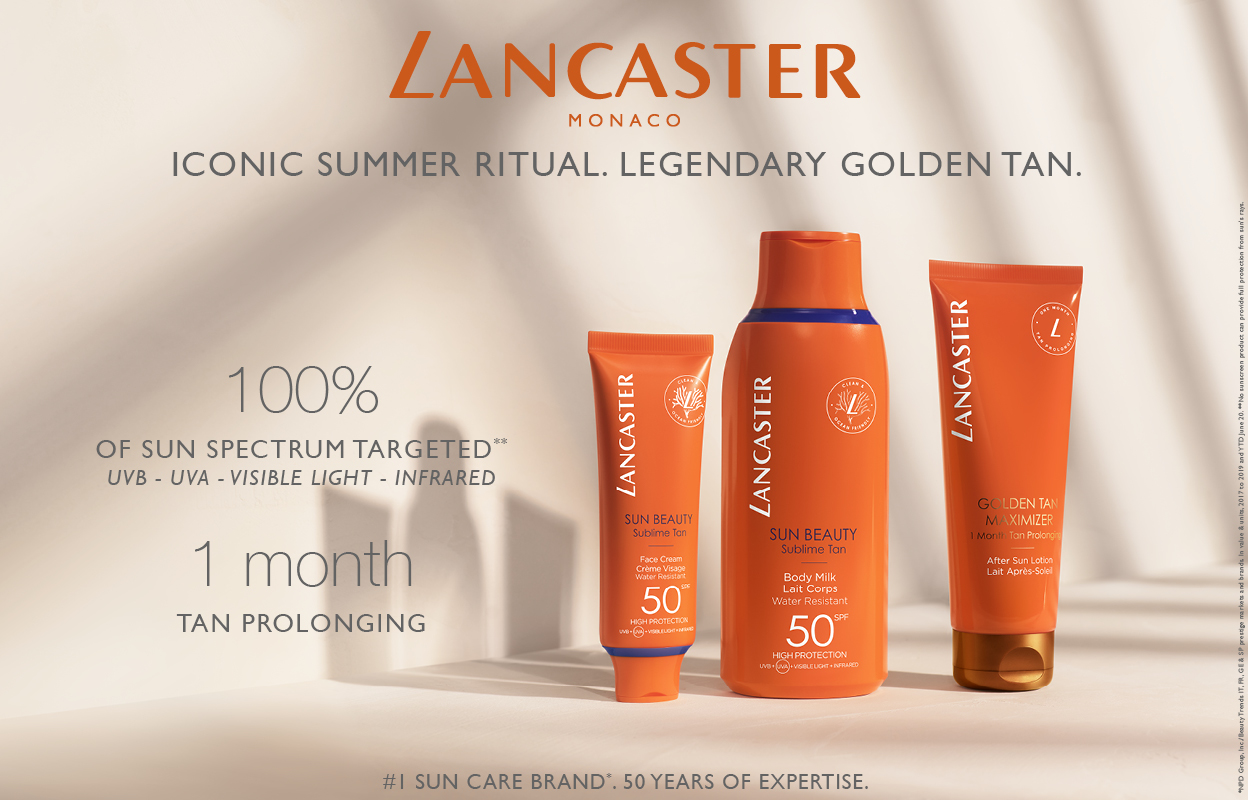 Tre solskyddsprodukter från Lancaster, placerade på en ljus bakgrund. Texten på bilden lyder "Iconic Summer Ritual. Legendary Golden Tan." och "100% of Sun Spectrum Targeted" samt "1 month Tan Prolonging".