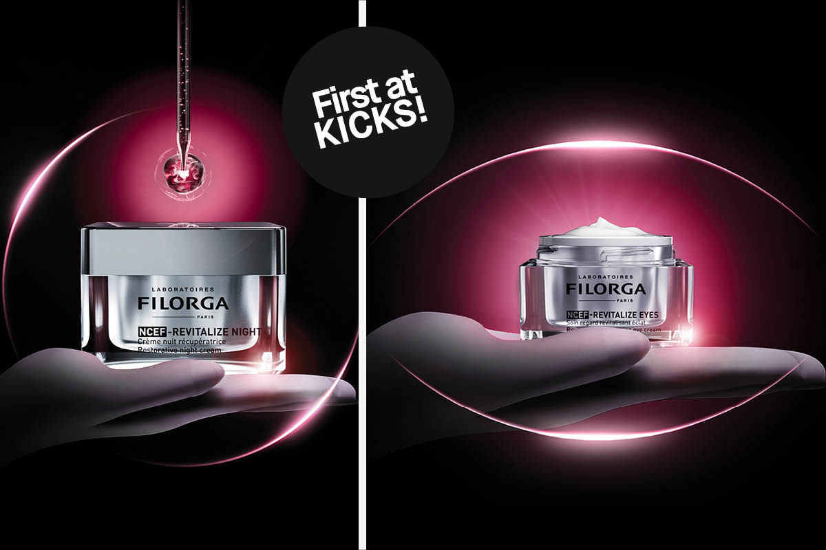 Två Filorga-produkter: till vänster NCEF-Revitalize Night nattkräm i en silverfärgad burk, till höger NCEF-Revitalize Eyes ögonkräm i en silverfärgad burk. Båda burkarna vilar på en hand, omgiven av en rosa glöd. I mitten en svart cirkel med texten "First at KICKS!".