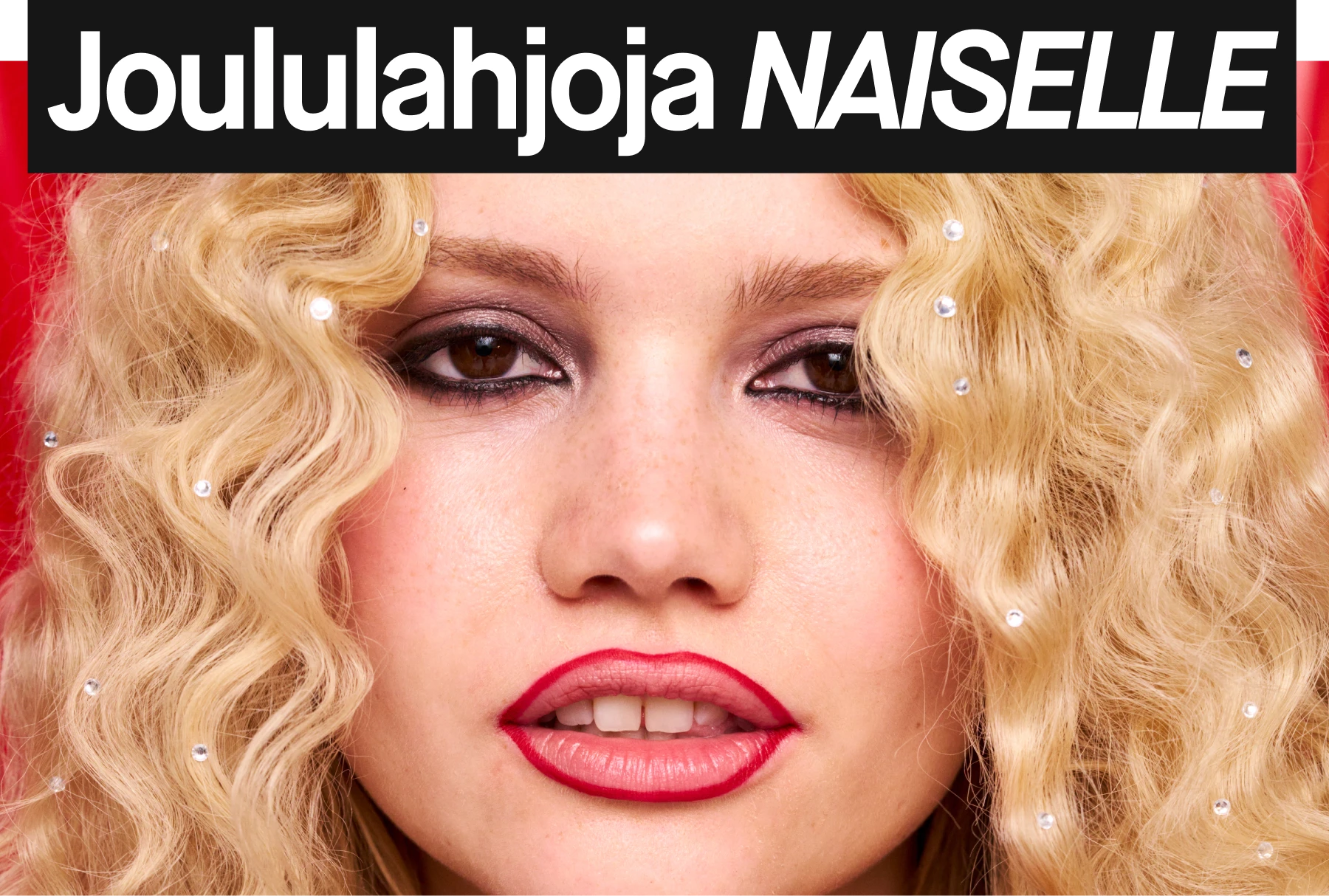 Vaaleat, kiharat hiukset, joissa on koristeellisia kimalteita punaisella taustalla.