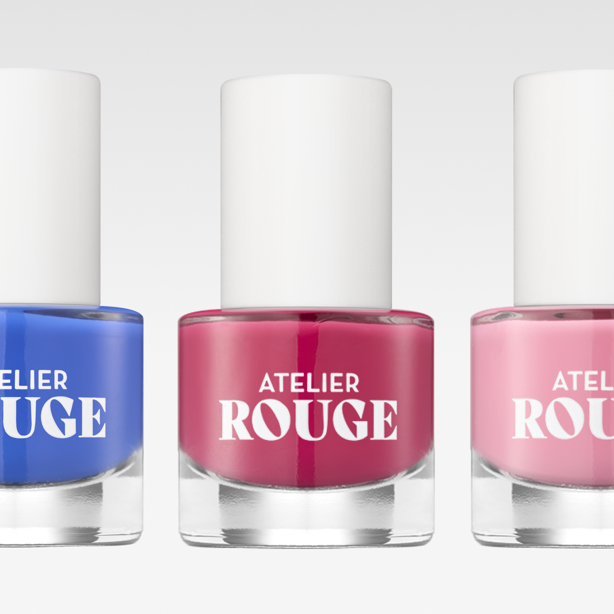 Atelier Rouge neglelakk i tre farger: blå, rød og rosa.