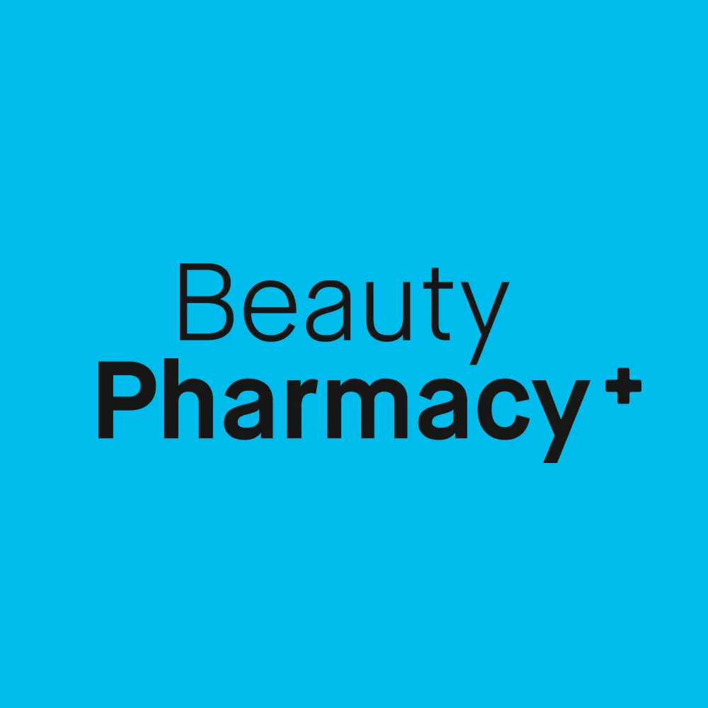 Texten "Beauty Pharmacy+" på en blå bakgrund.