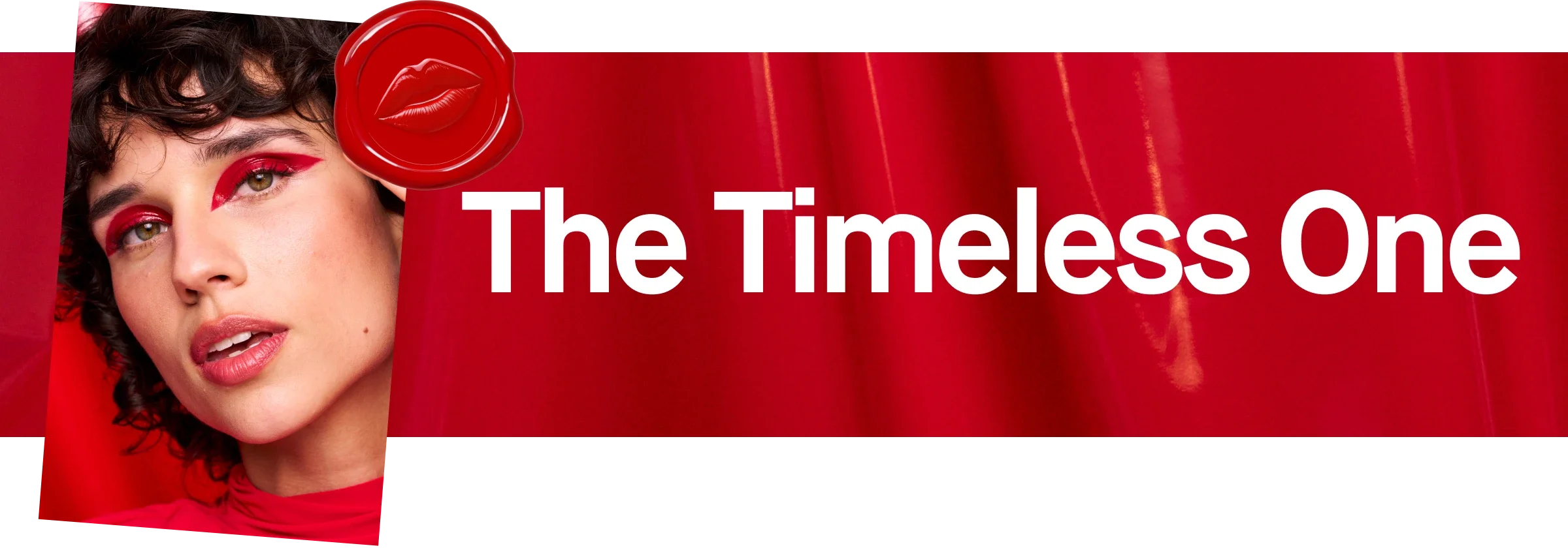 Punainen tausta, jossa teksti "The Timeless One" ja punainen sinetti huulien kuvalla.