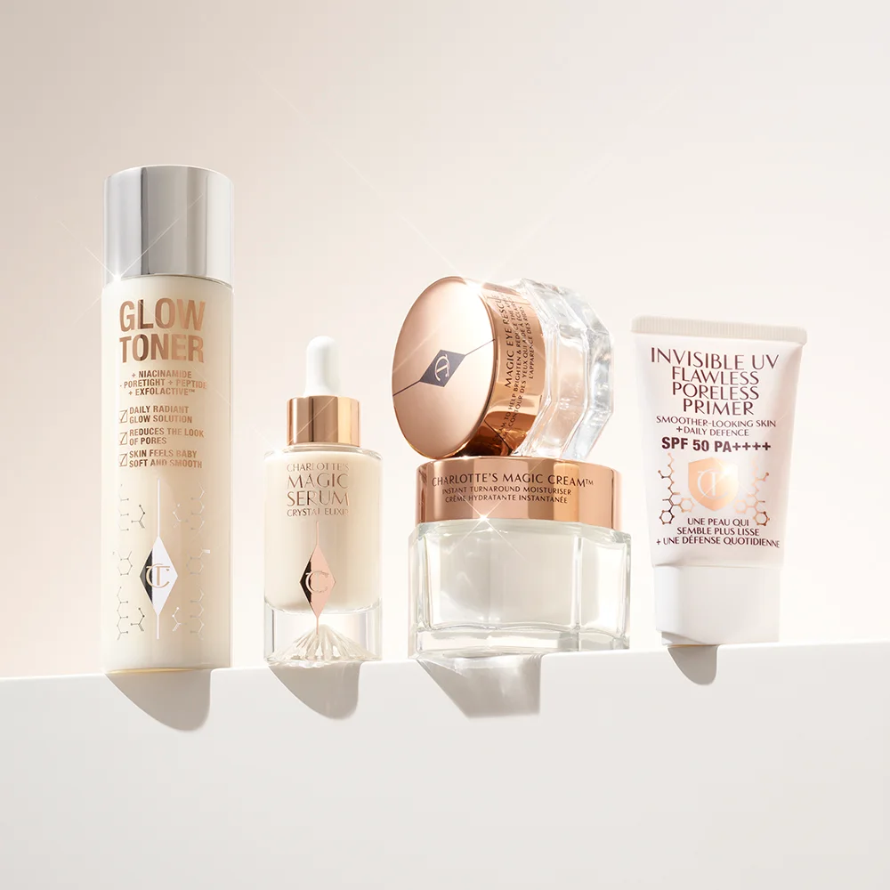Charlotte Tilbury hudpleieprodukter, inkludert toner, serum, fuktighetskrem og primer.