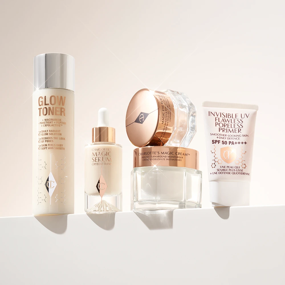 Charlotte Tilbury -ihonhoitotuotteita, mukaan lukien kasvovesi, seerumi, kosteusvoide ja pohjustusvoide.