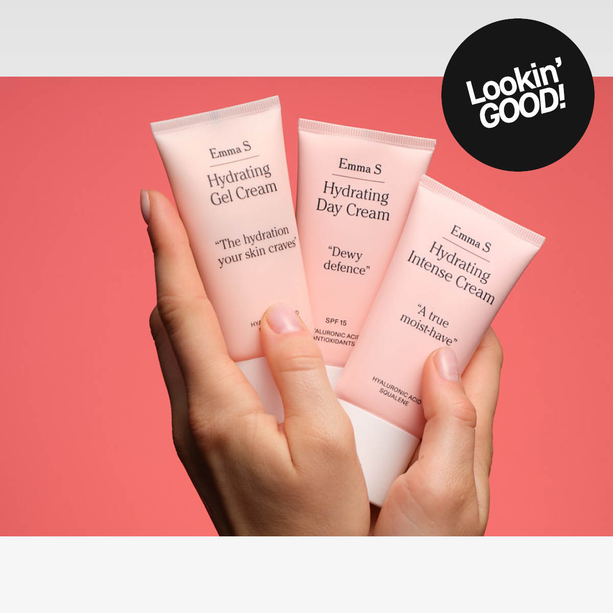 Händer håller tre återfuktande krämer från Emma S i rosa tuber. Krämerna heter Hydrating Gel Cream, Hydrating Day Cream och Hydrating Intense Cream.
