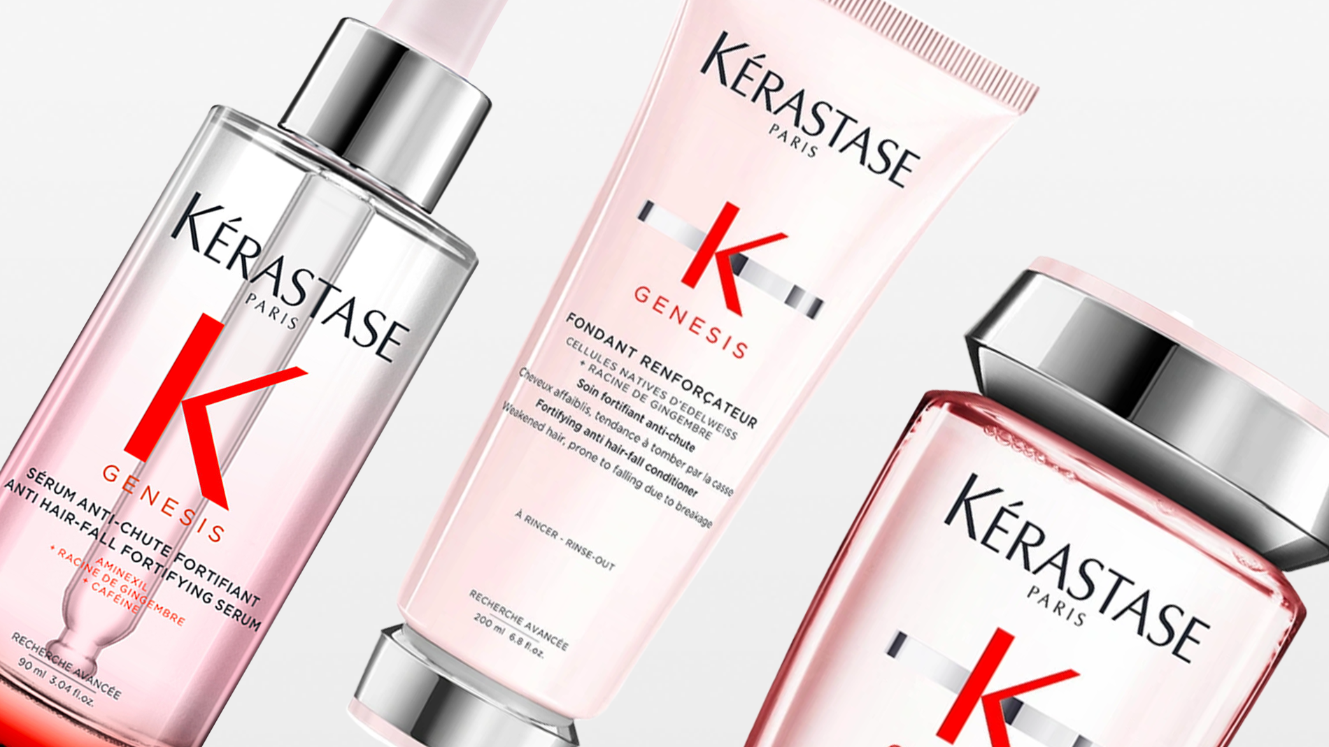 Tuotekuva, jossa kolme Kérastase Paris Genesis -hiustenhoitotuotetta vaaleaa taustaa vasten. Näkyvissä seerumi, hoitoaine ja shampoo vaaleanpunaisen ja hopean sävyissä. Vahvistava ja ravitseva hiustenhoitosarja.