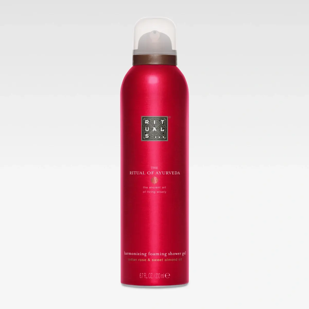Röd aerosolflaska från Rituals med texten “RITUALS The Ritual of Ayurveda” och “harmonizing foaming shower gel”. Texten inkluderar “indian rose & sweet almond oil” och “200 ml / 6.7 fl. oz”.