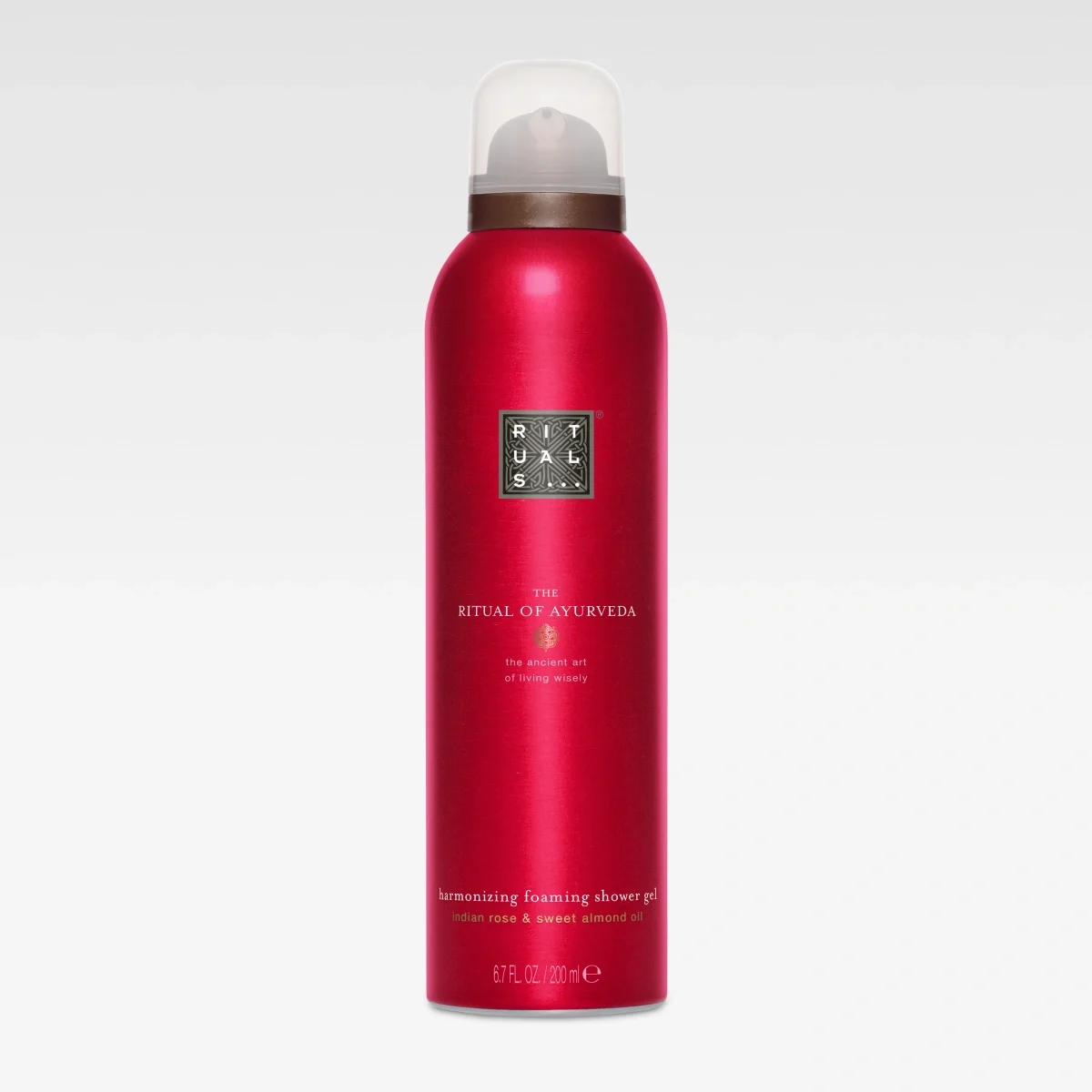 Röd aerosolflaska från Rituals med texten “RITUALS The Ritual of Ayurveda” och “harmonizing foaming shower gel”. Texten inkluderar “indian rose & sweet almond oil” och “200 ml / 6.7 fl. oz”.